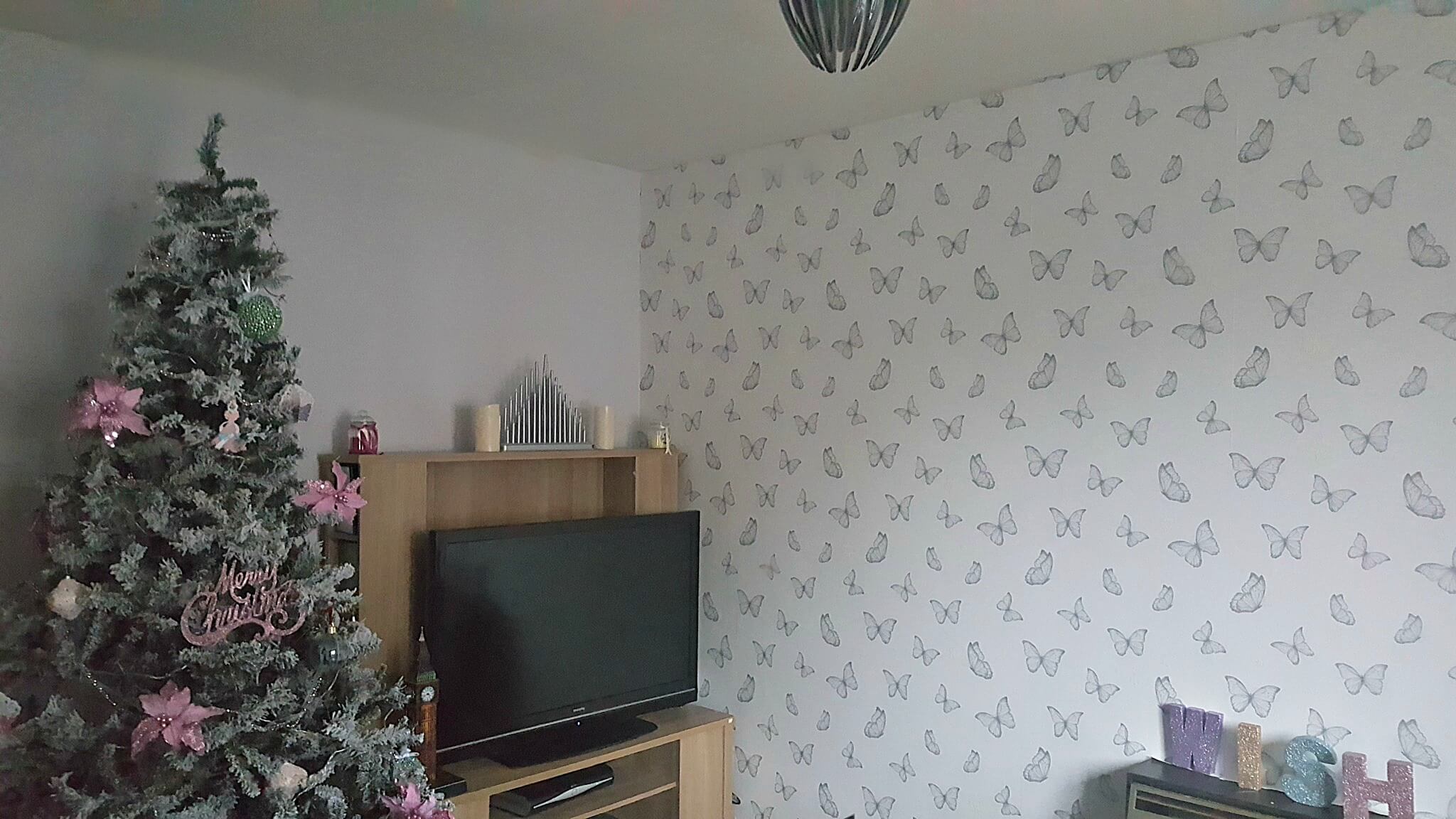 new year new look picture of living room with a pink decorated christmas tree