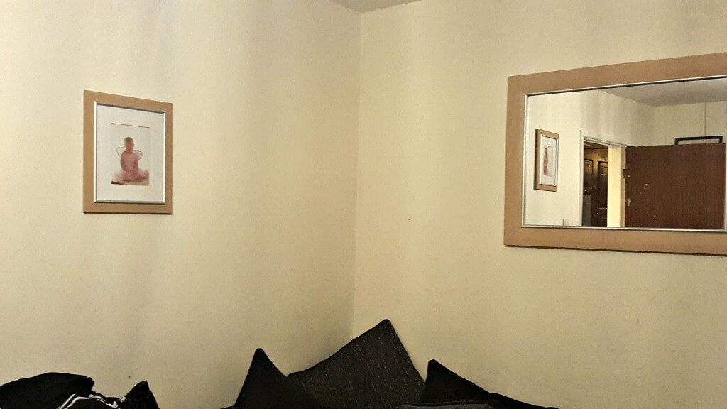 new year, new look picture of mirror on magnolia painted wall