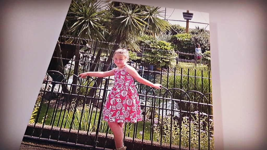 a canvas picture of a girl by a fence for a staycation in great yarmouth