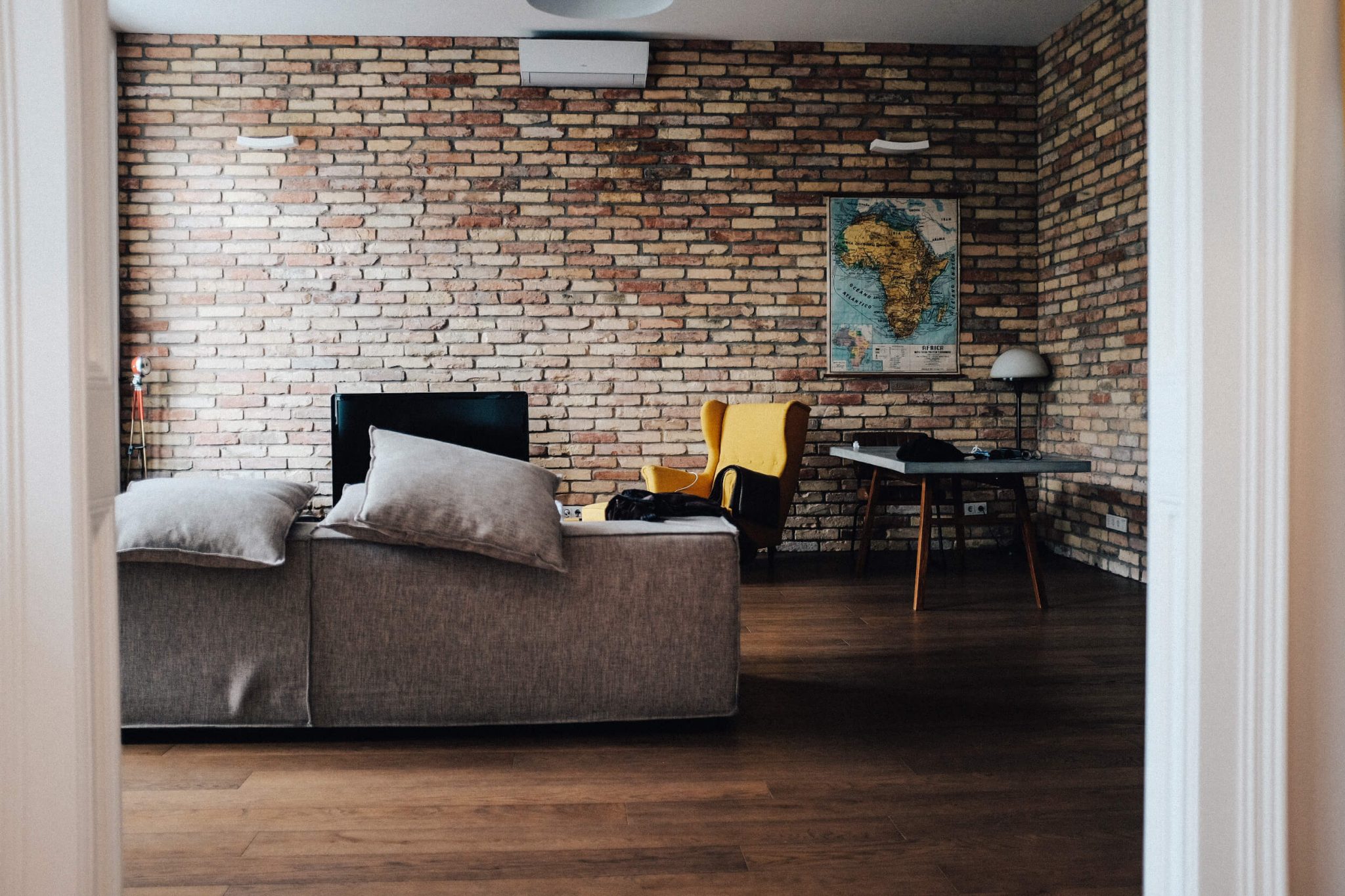 redecorating the living room bare brick room with sofa and accessories