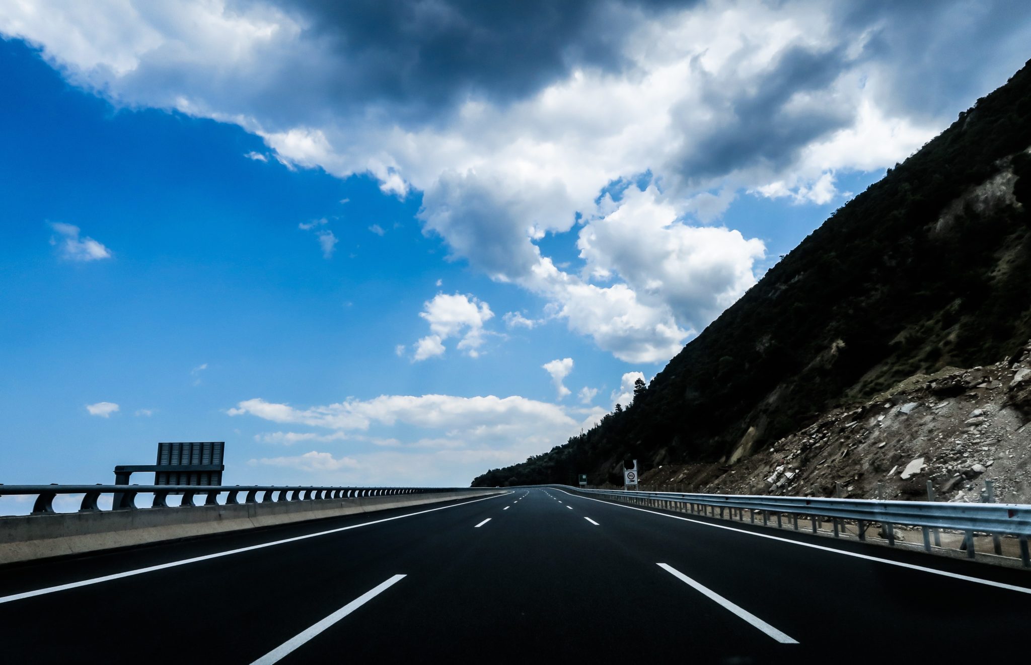 car safety checks for long journeys - open road on the mountain