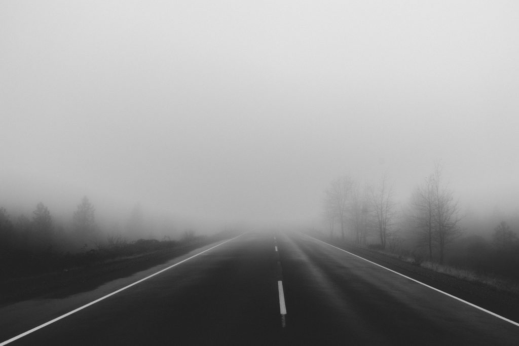 foggy road depicting bad weather driving