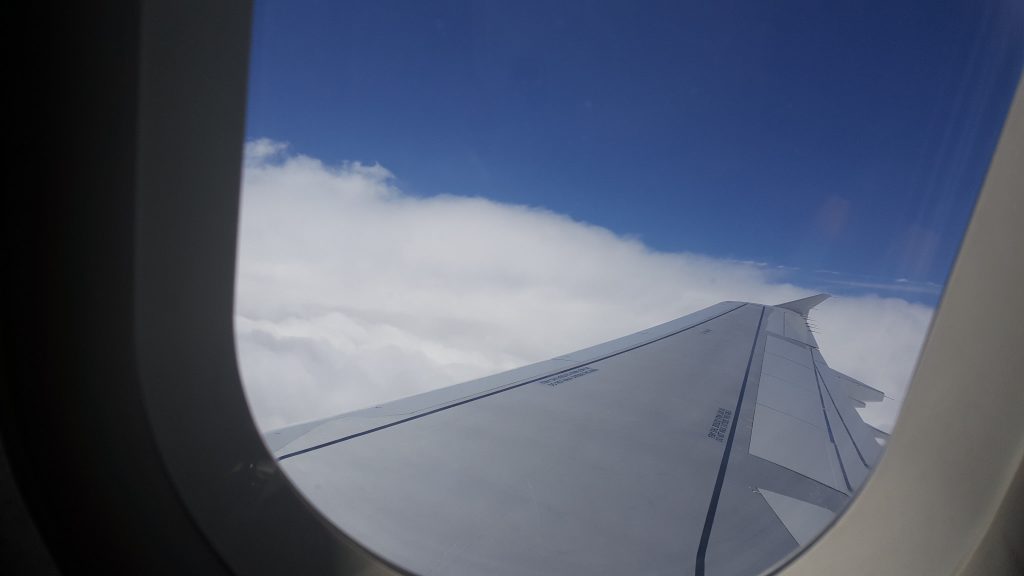 travelling with toddlers - view from an aeroplane window with the wing of the plane