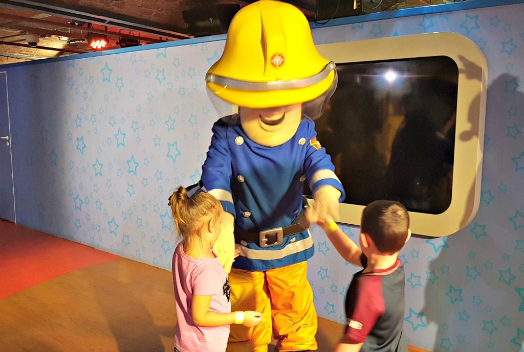boy and girl meeting fireman sam character