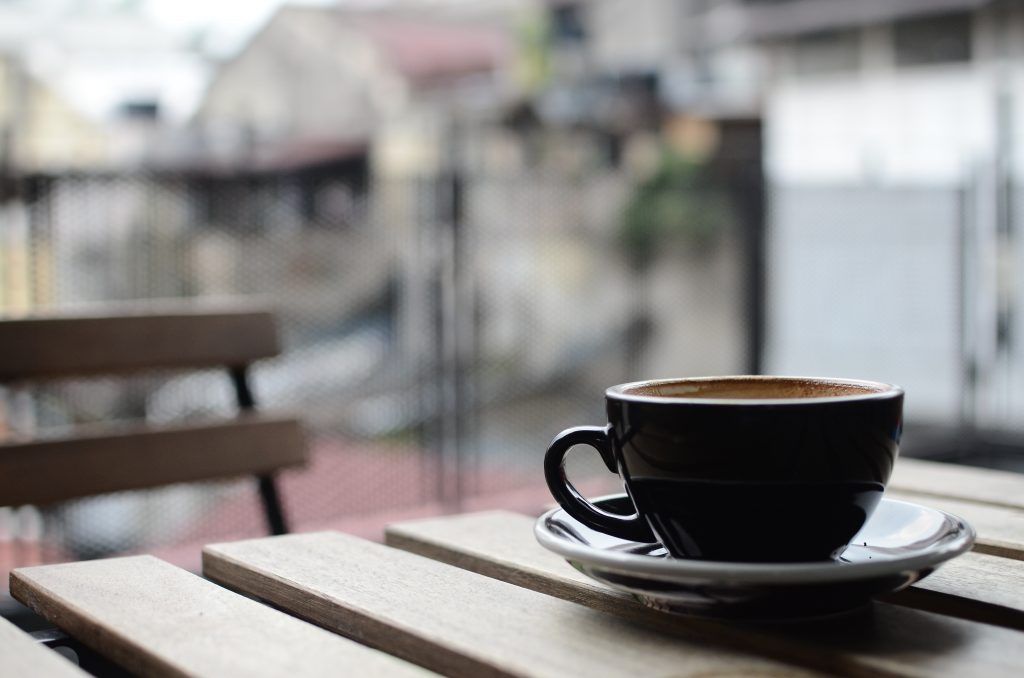 cup and saucer on a wooden table