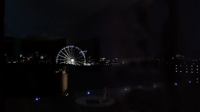 view of the big wheel in liverpool in the night from a window at the pullman hotel liverpool