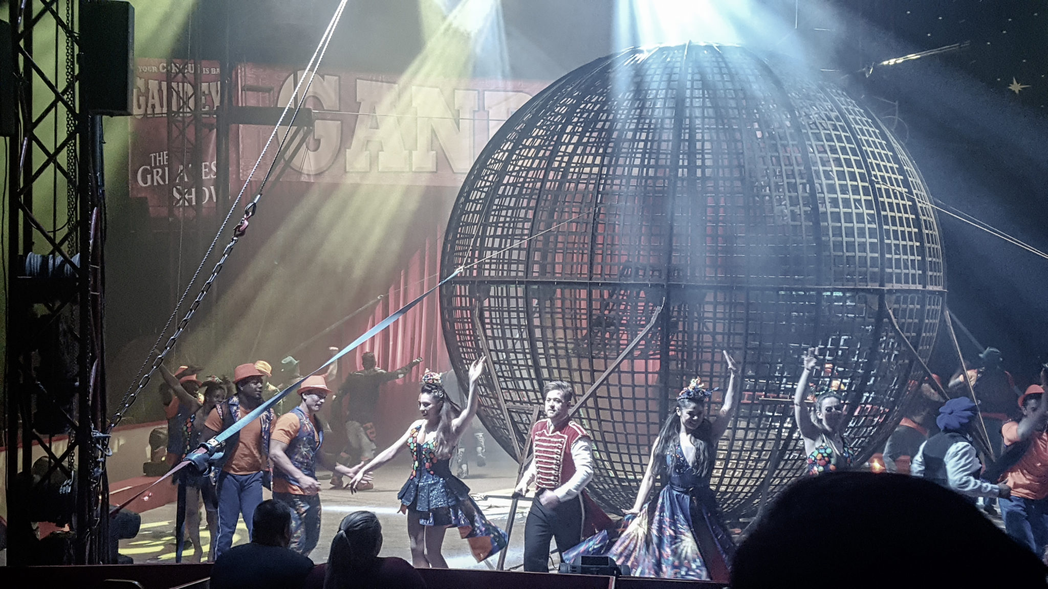 performers for gandeys circus around the metal cage