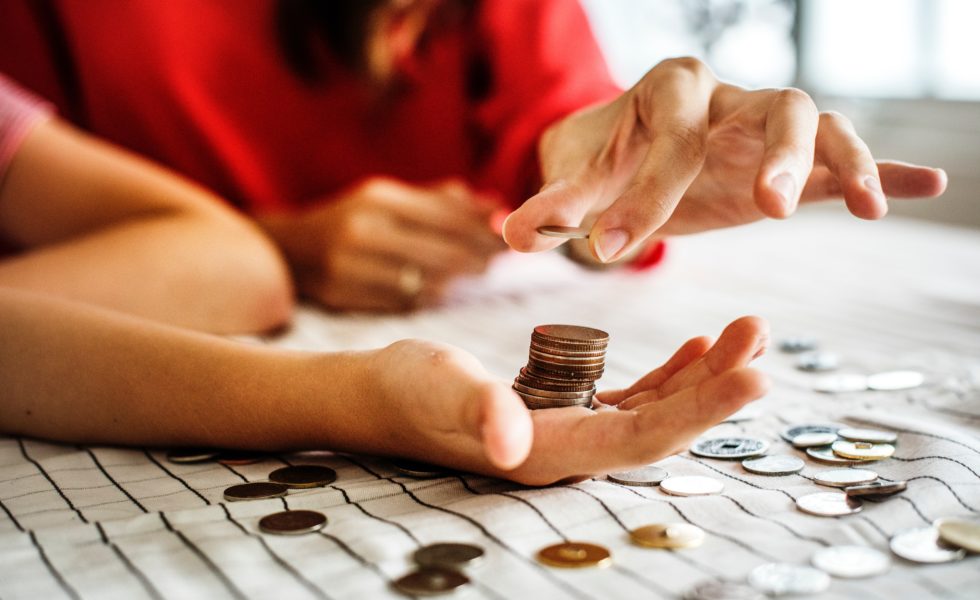 hand holding coins