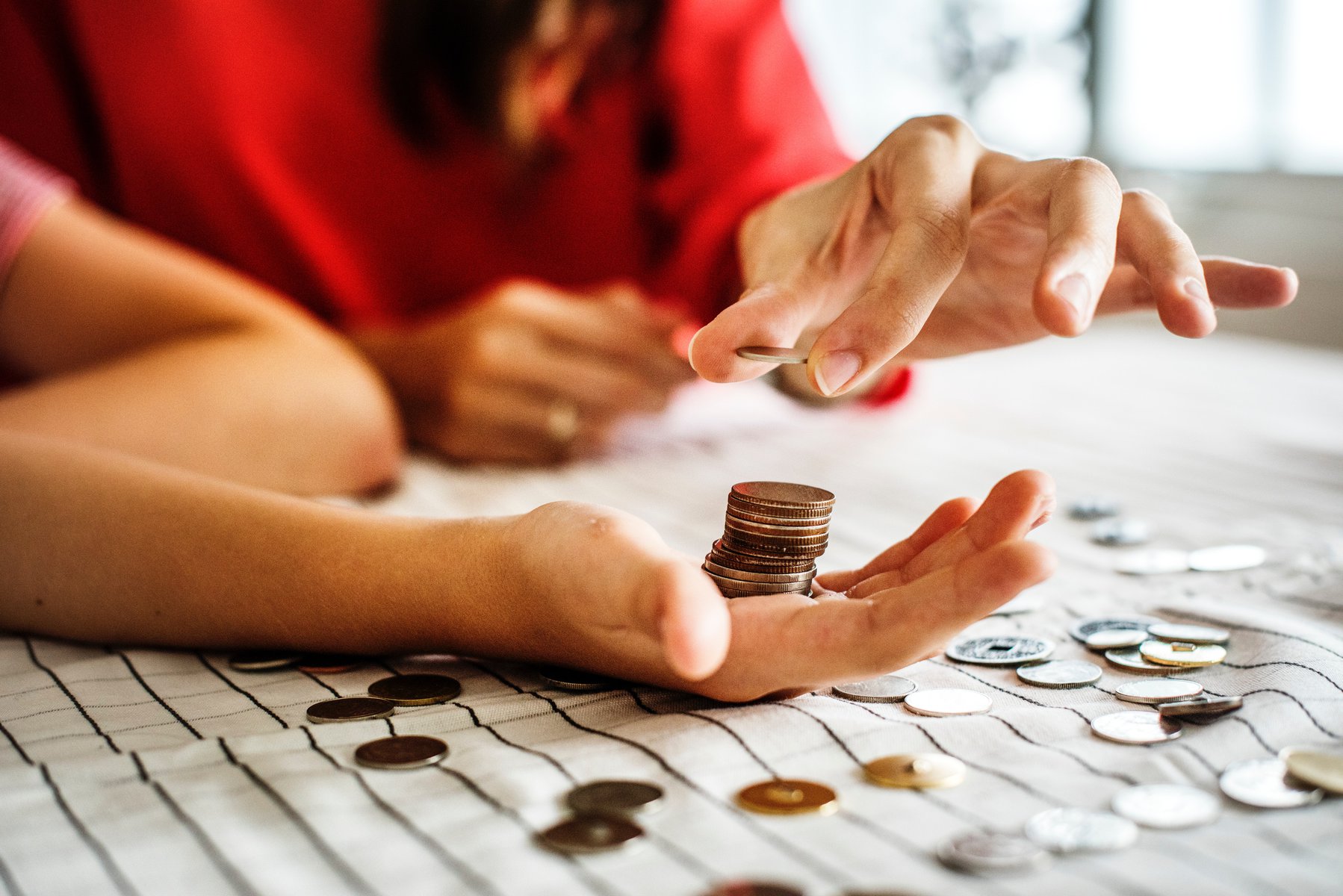 hand holding coins