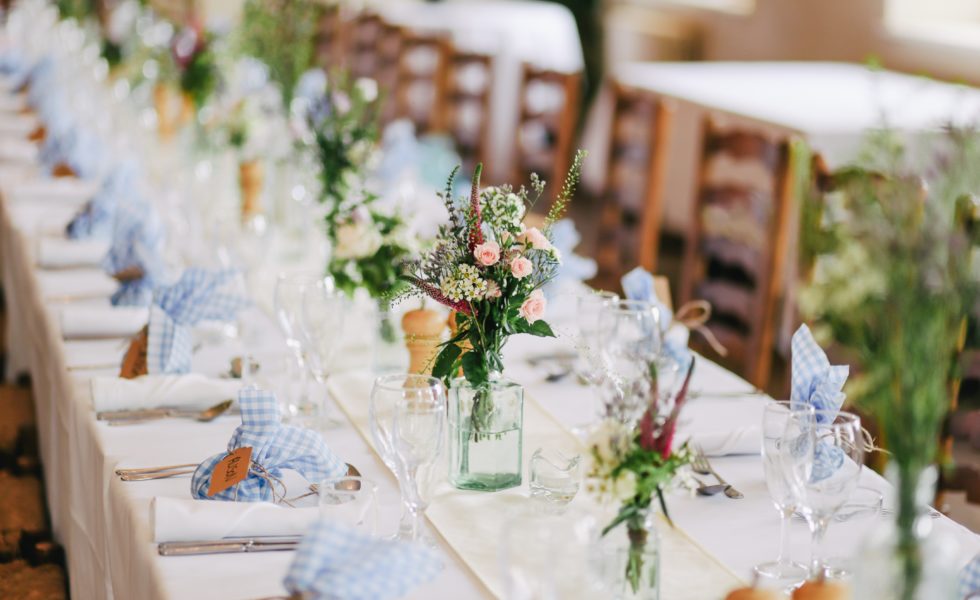 decorated wedding table and chairs with flowers