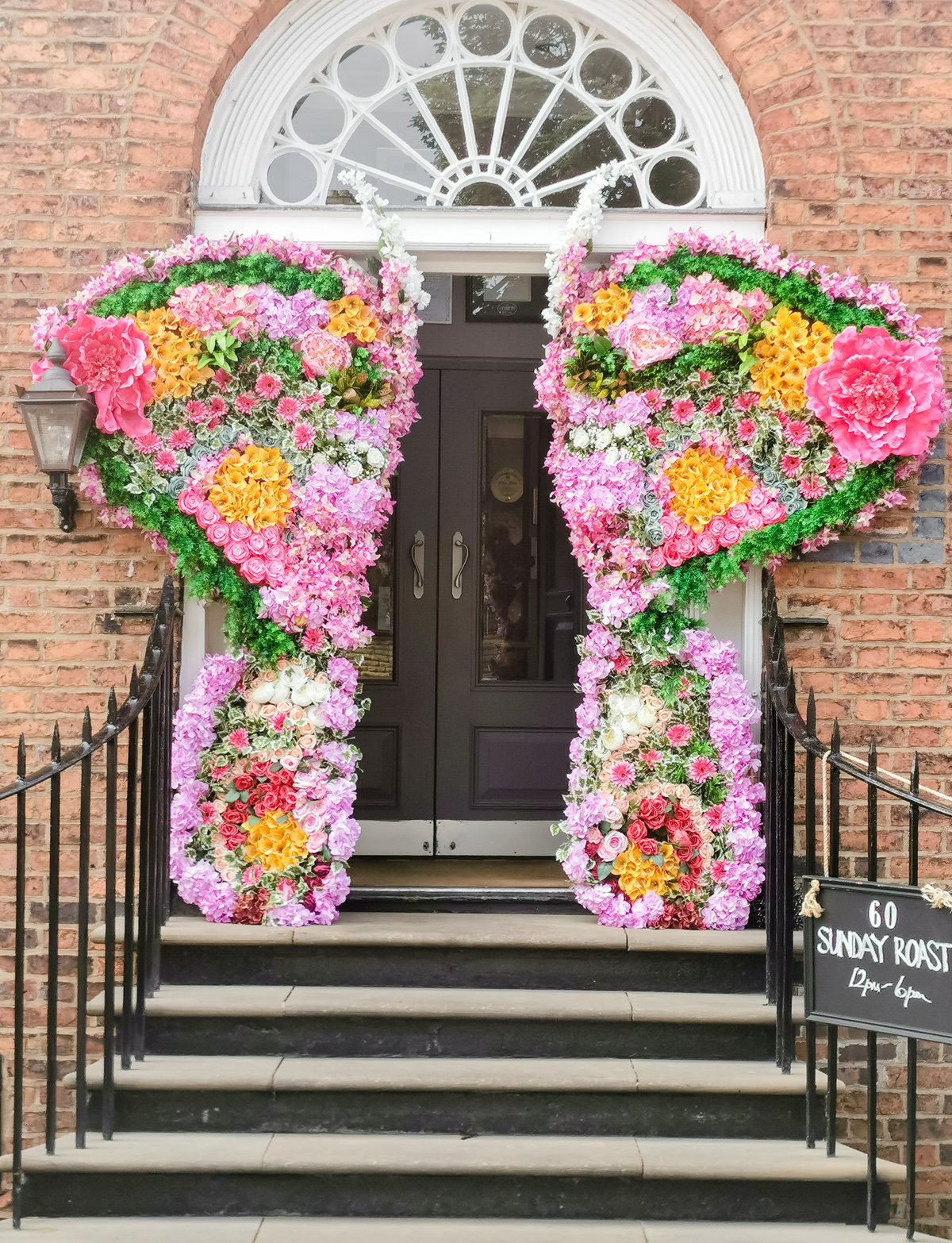 flower displays at a doorway for the restaurant 60 hope street