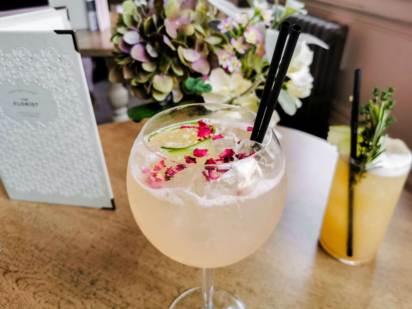 a gin cocktail with garnish