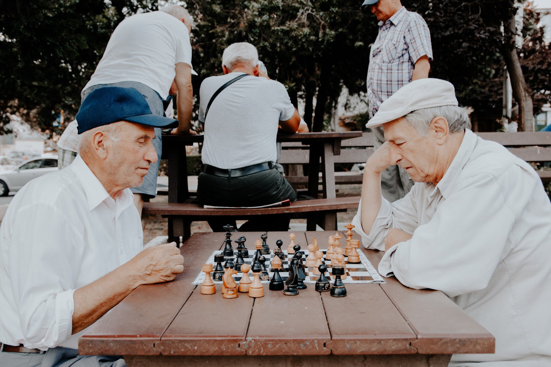elderly gentlemen playing chess