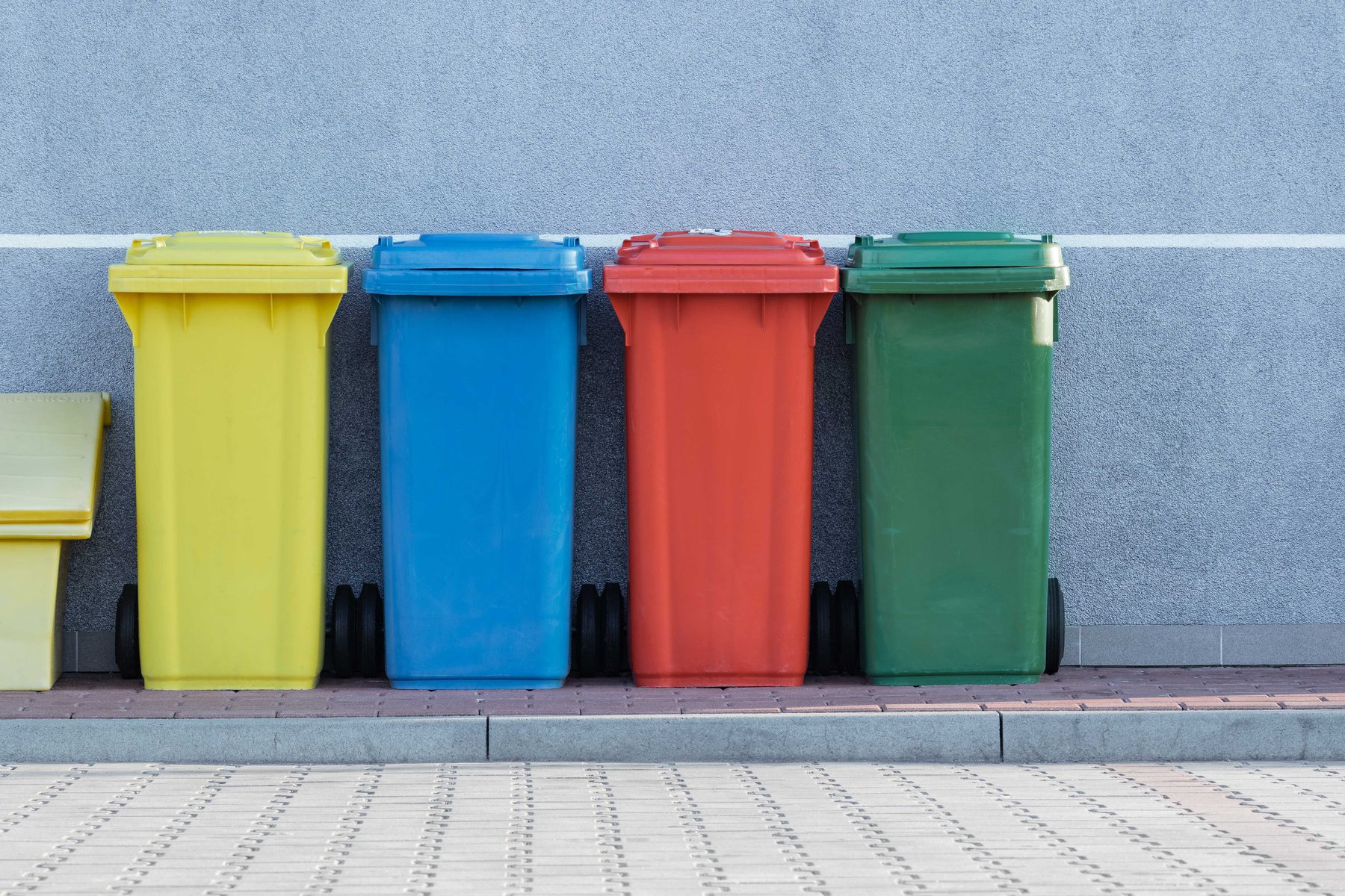 different coloured recycling bins