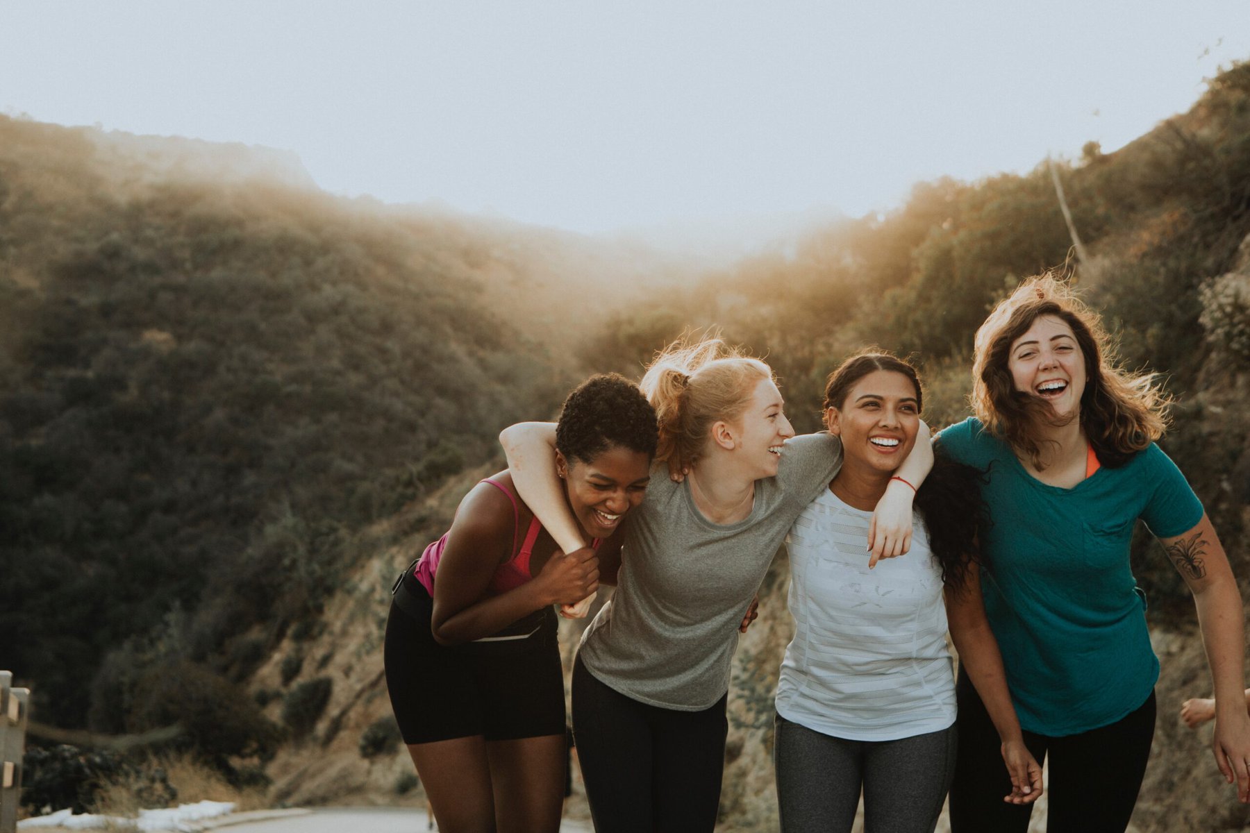 group of women in low light in a grassy area