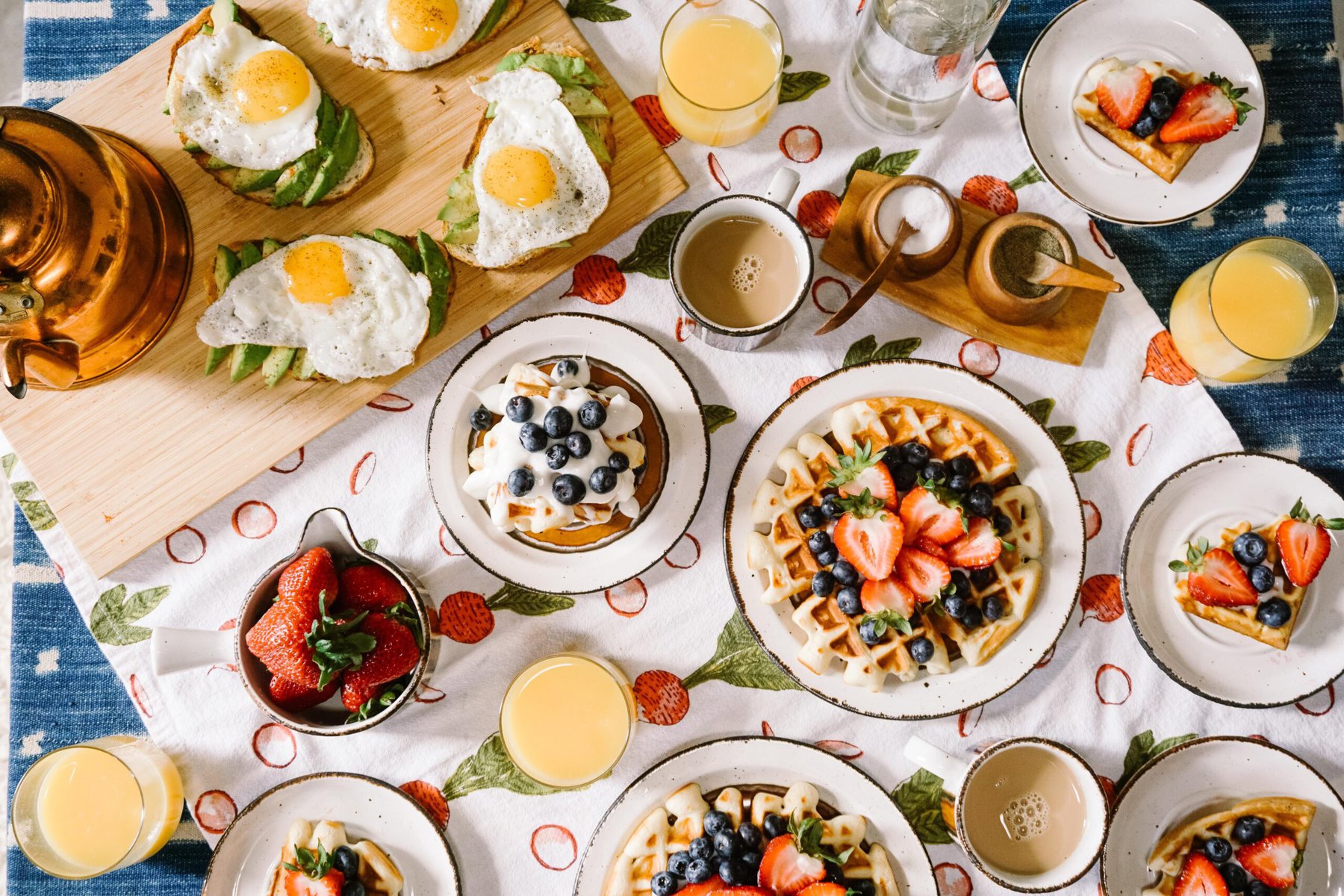 aerial shot of multiple plates of breakfast dishes