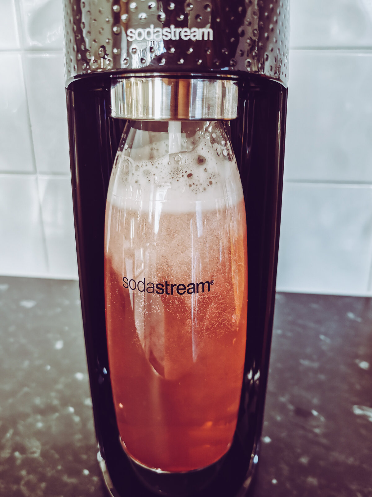 flavoured water in a soda stream