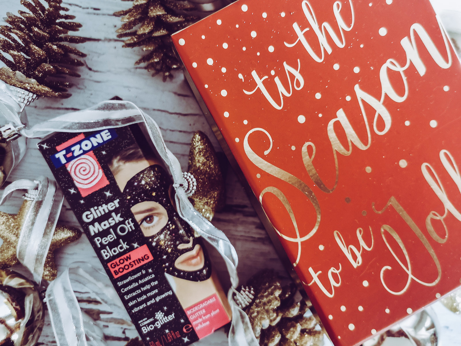 a box of tzone skin masks surrounded by xmas decorations