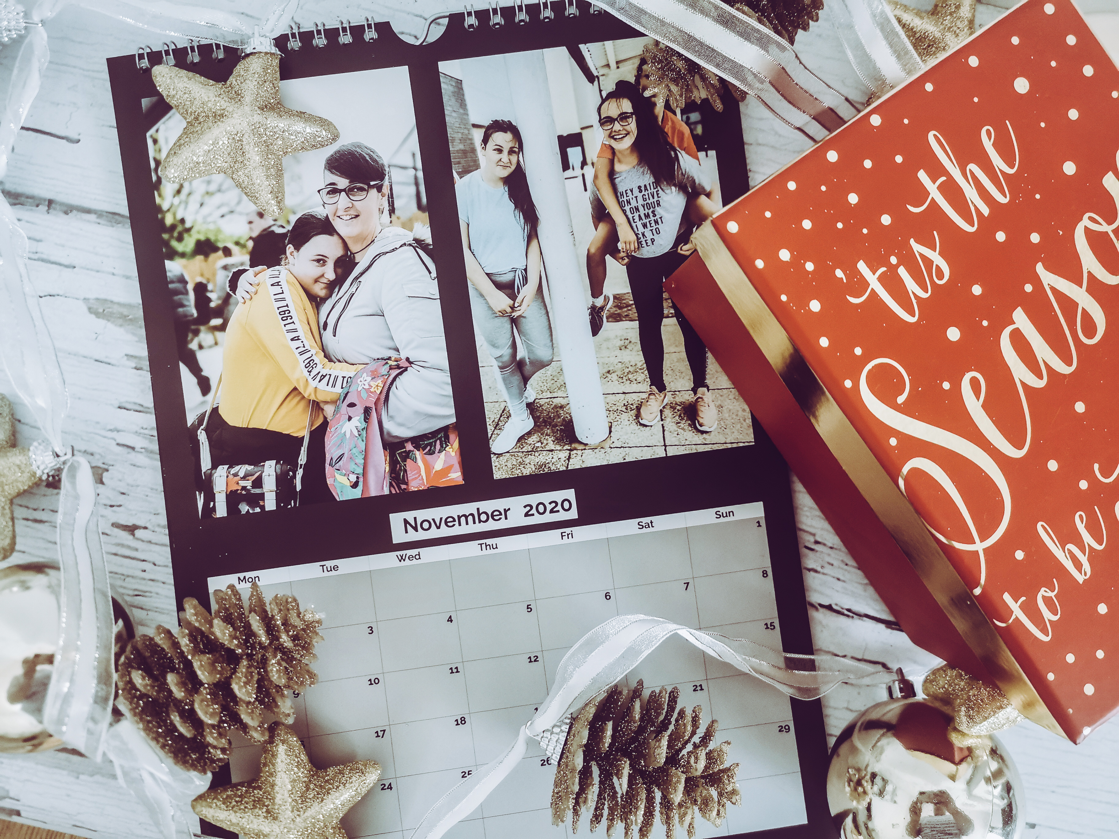 an asda photo calendar with xmas decorations around it