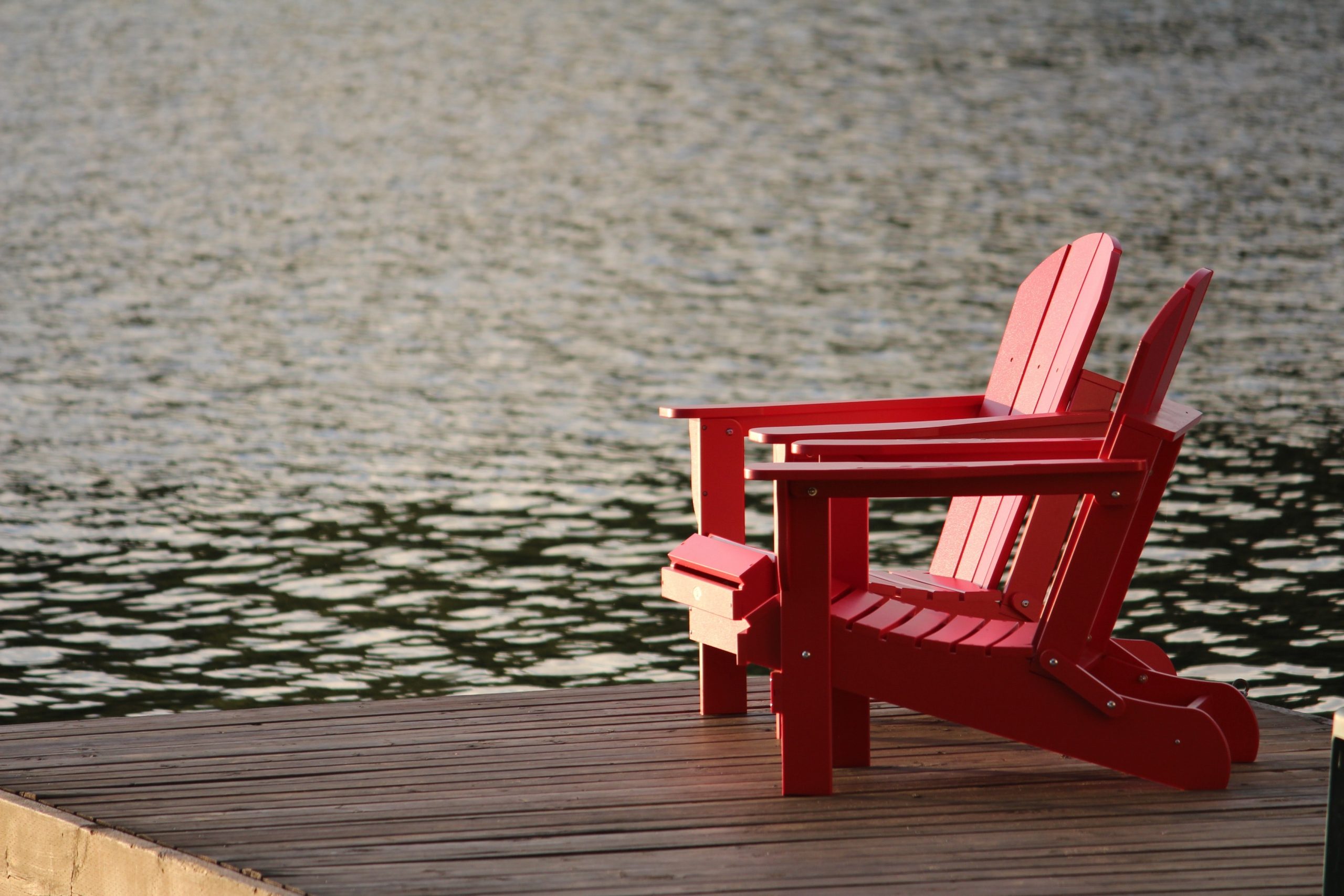 red wooden loungers on a dock