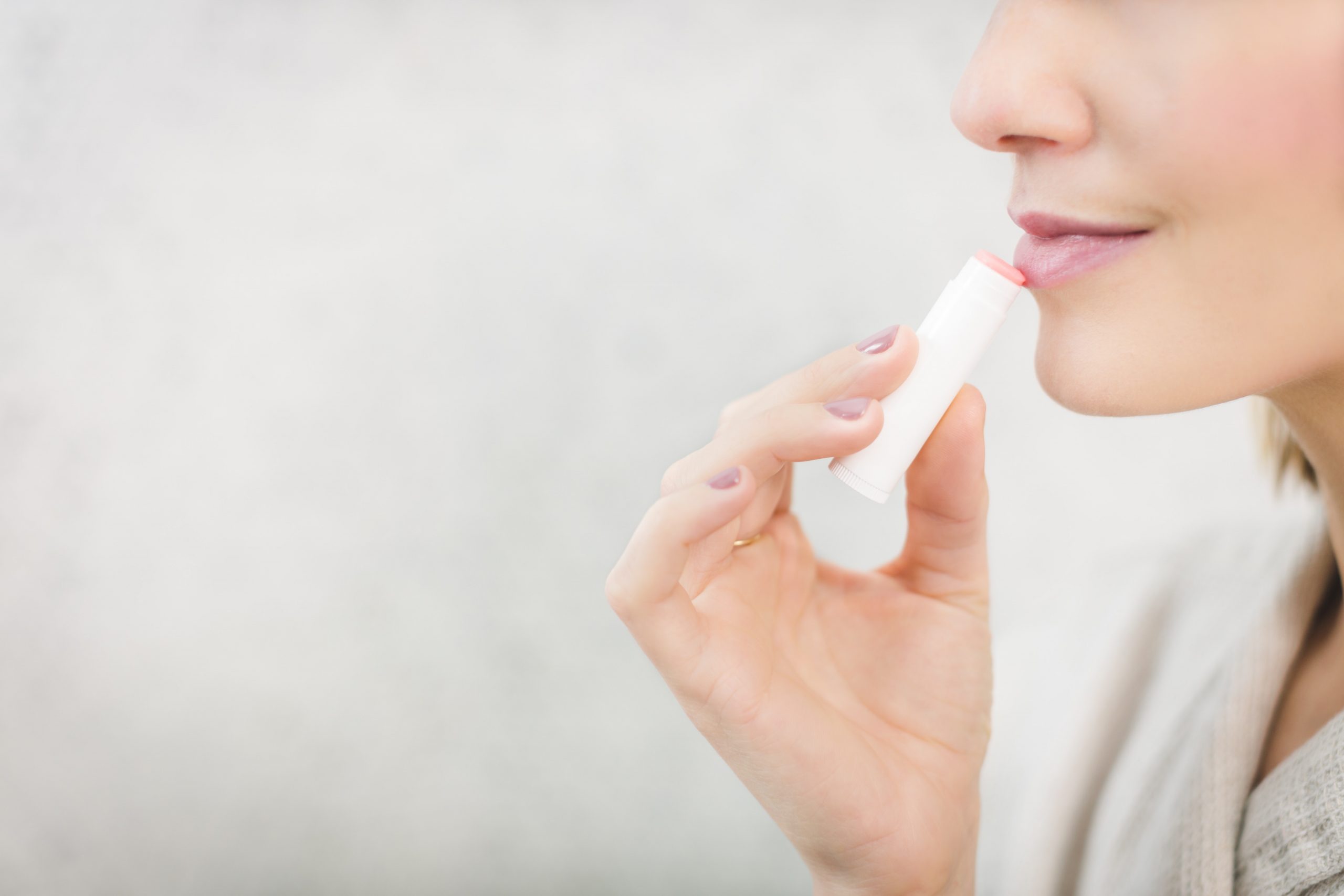 woman about to apply lip balm