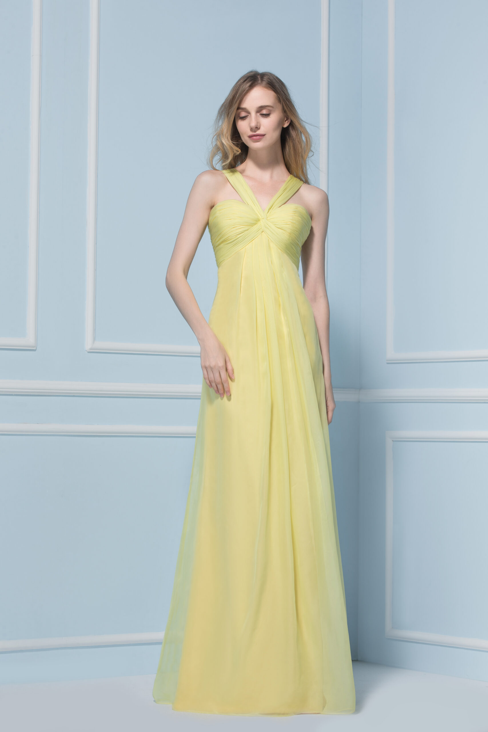 woman wearing a full length yellow dress