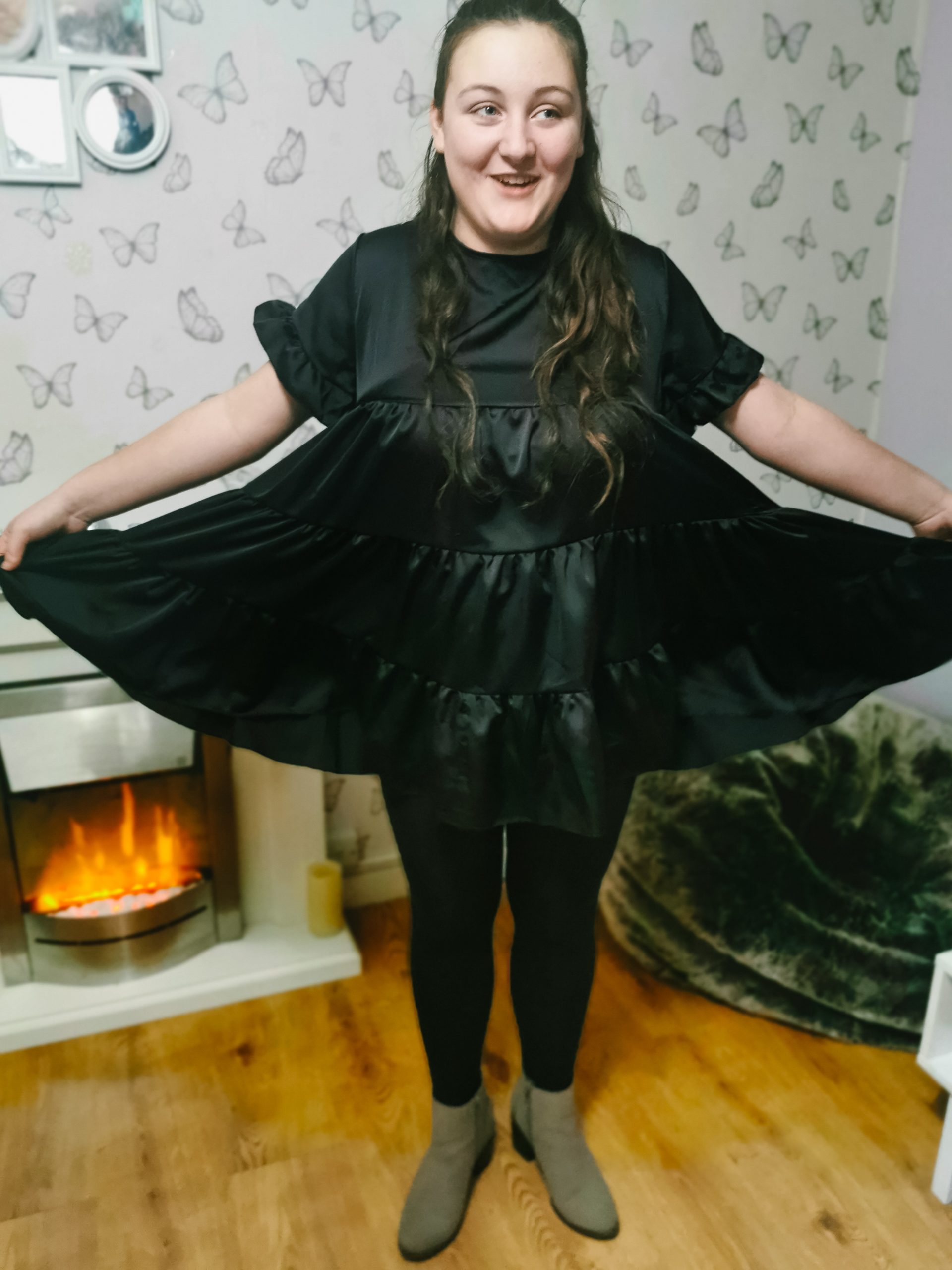 young girl wearing a baby doll dress from femme luxe style