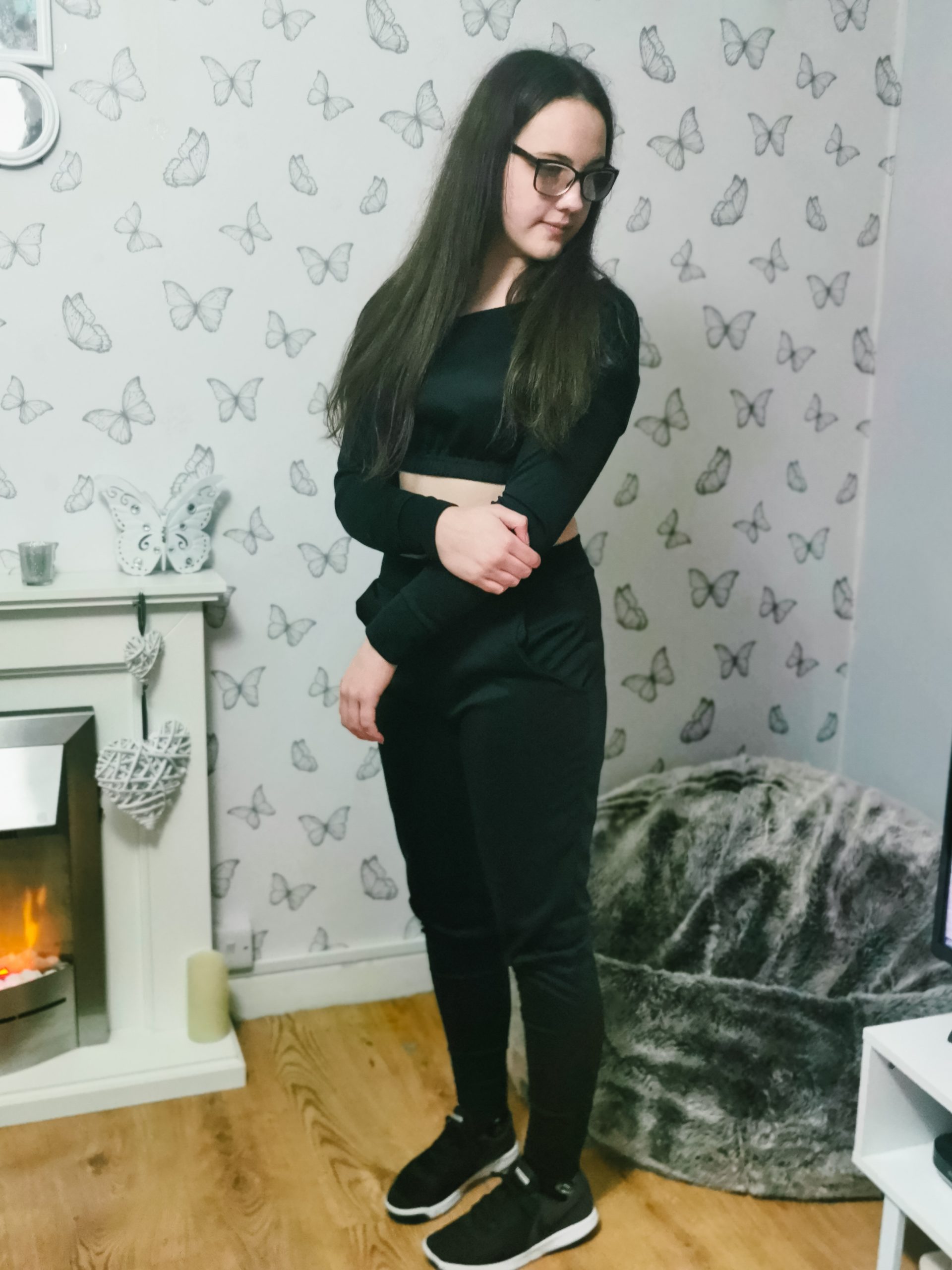 young girl wearing a femme luxe deanna lounge wear set in black