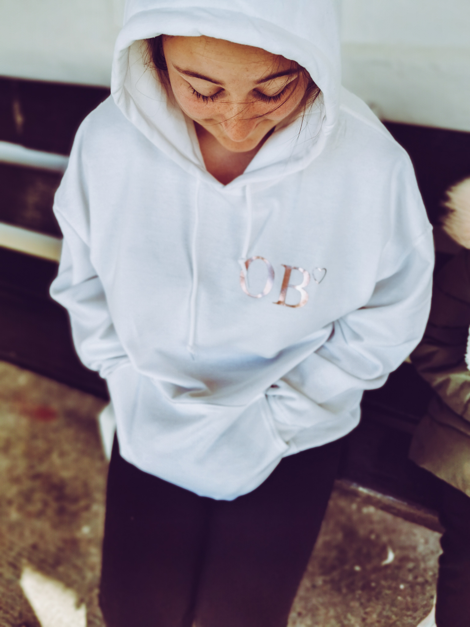 girl wearing a white hoodie