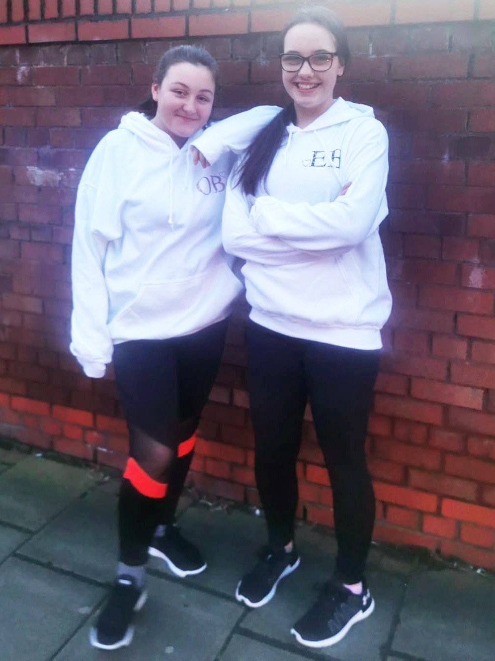 two teens wearing white hoodies from cookie dough kids