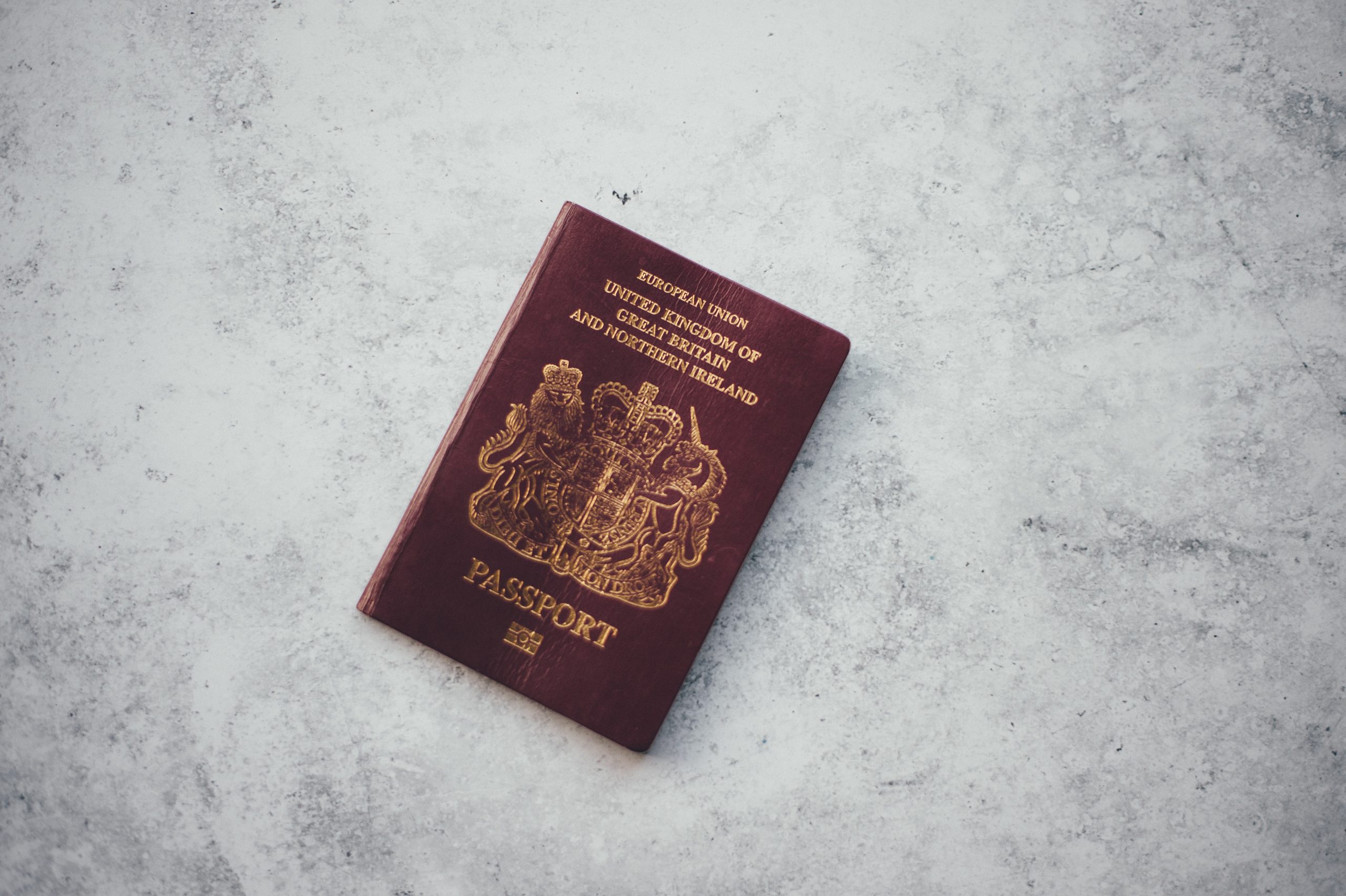 uk passport on a marble background