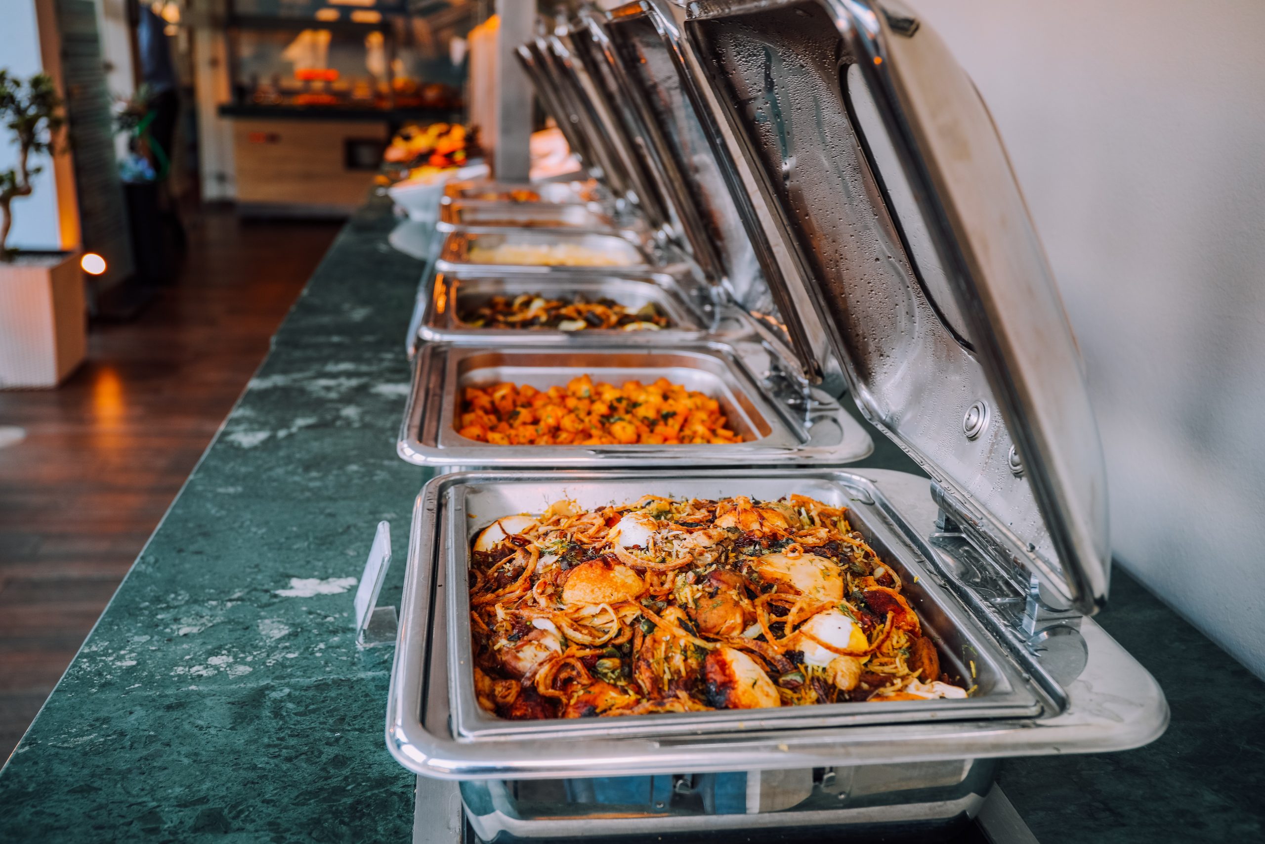 side shot of open buffet serving trays