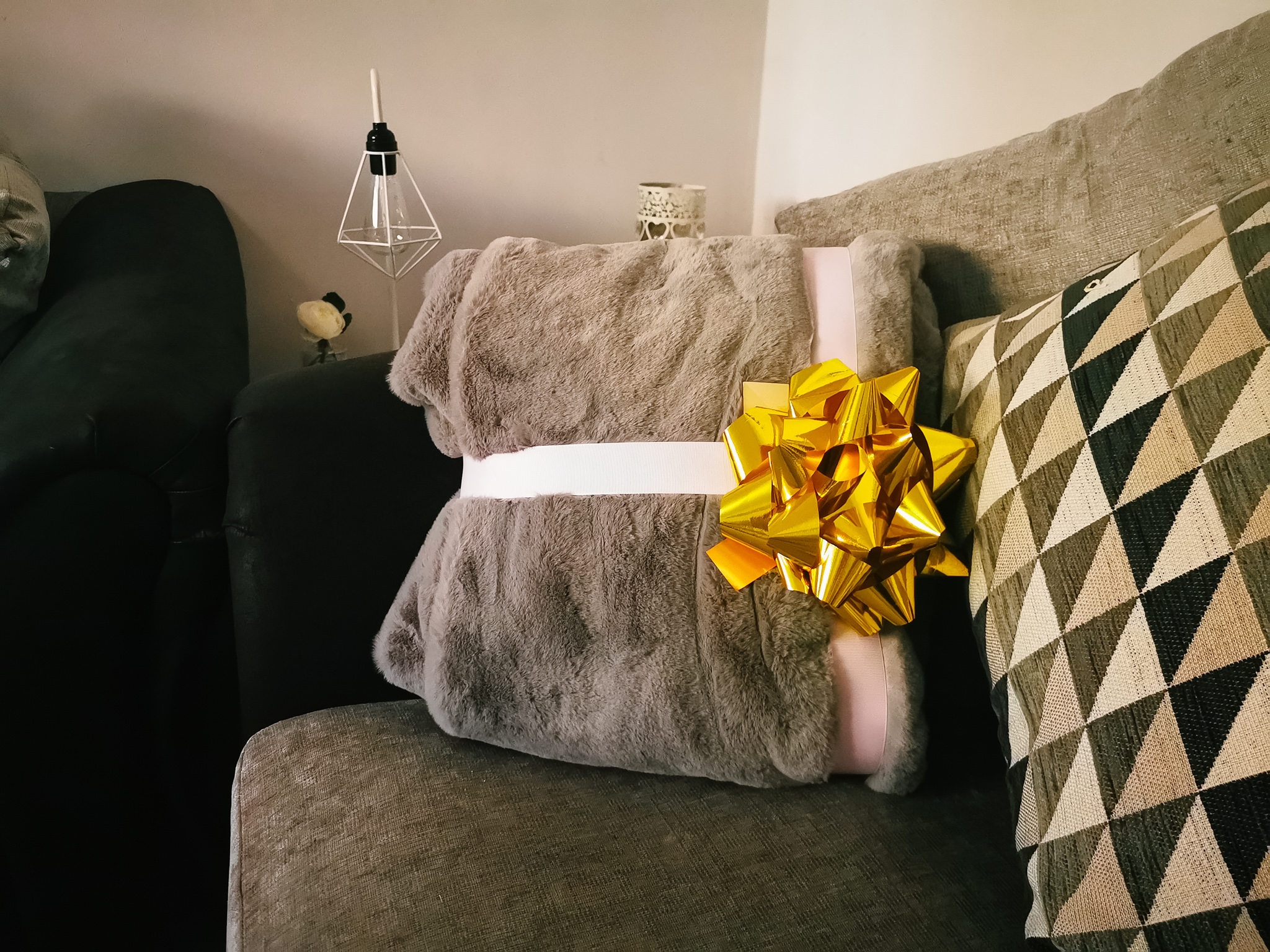 grey blanket on a sofa