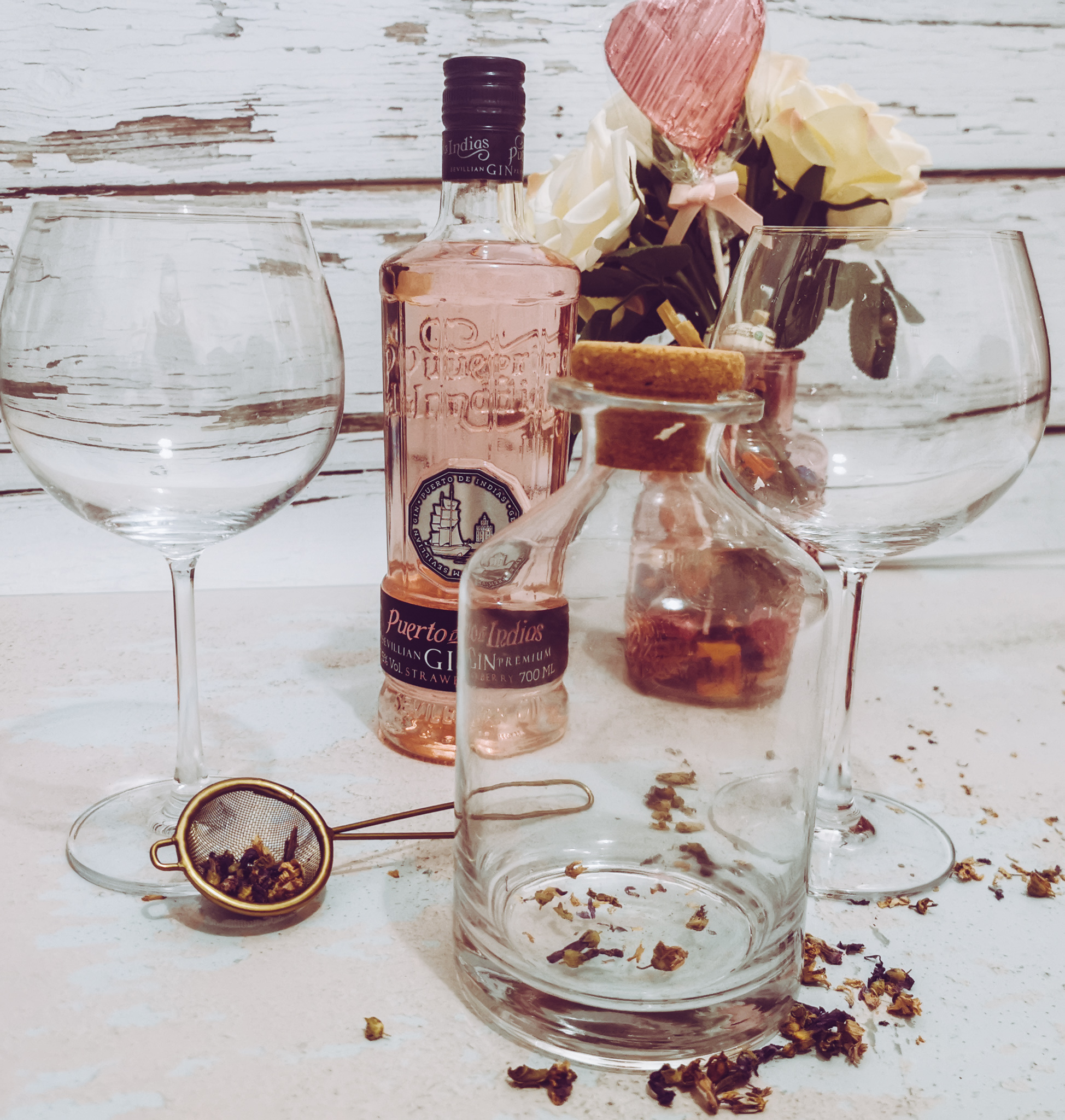 gin glasses and decanter set with bottle of strawberry gin