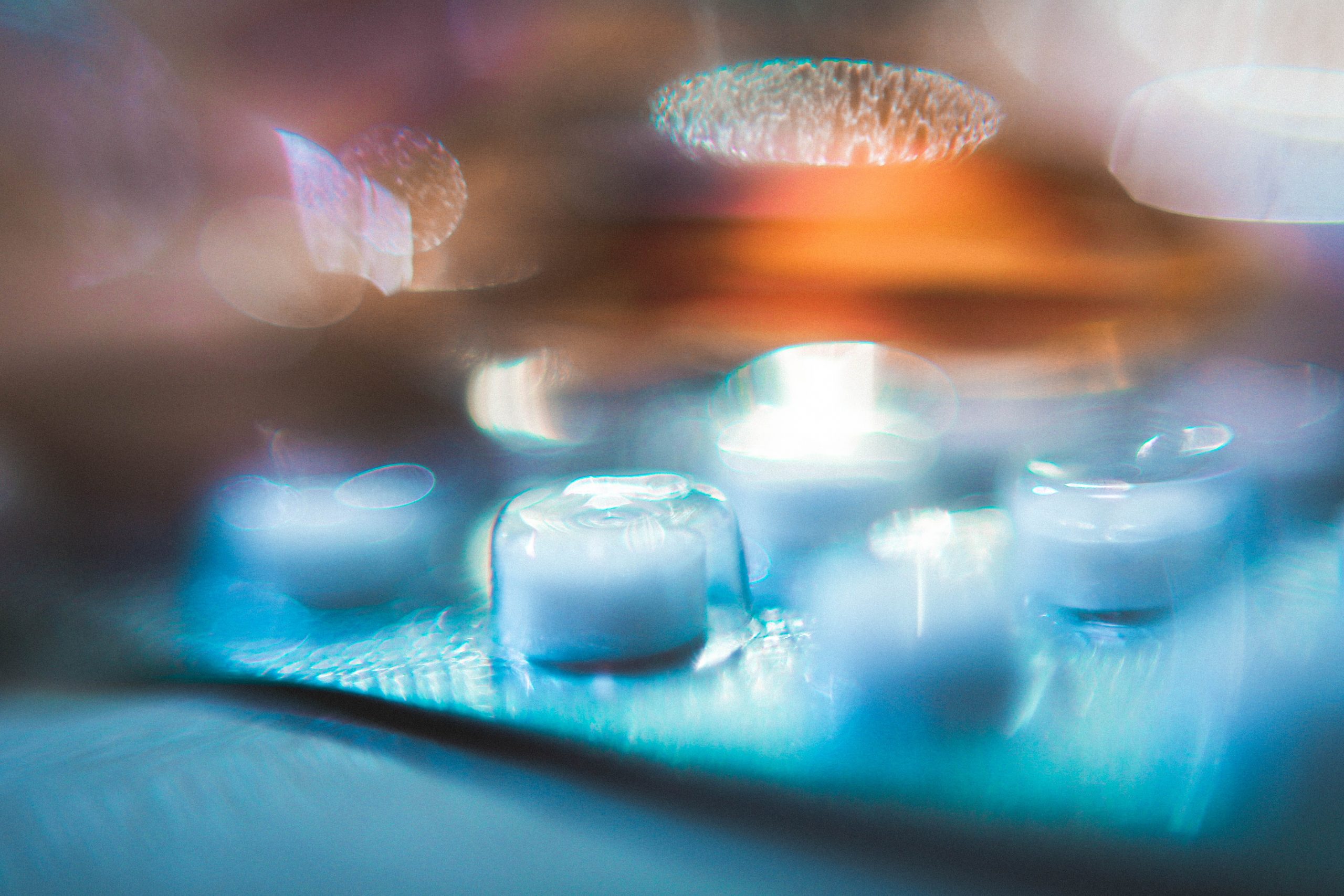 a blurred image of a blister strip of round tablets