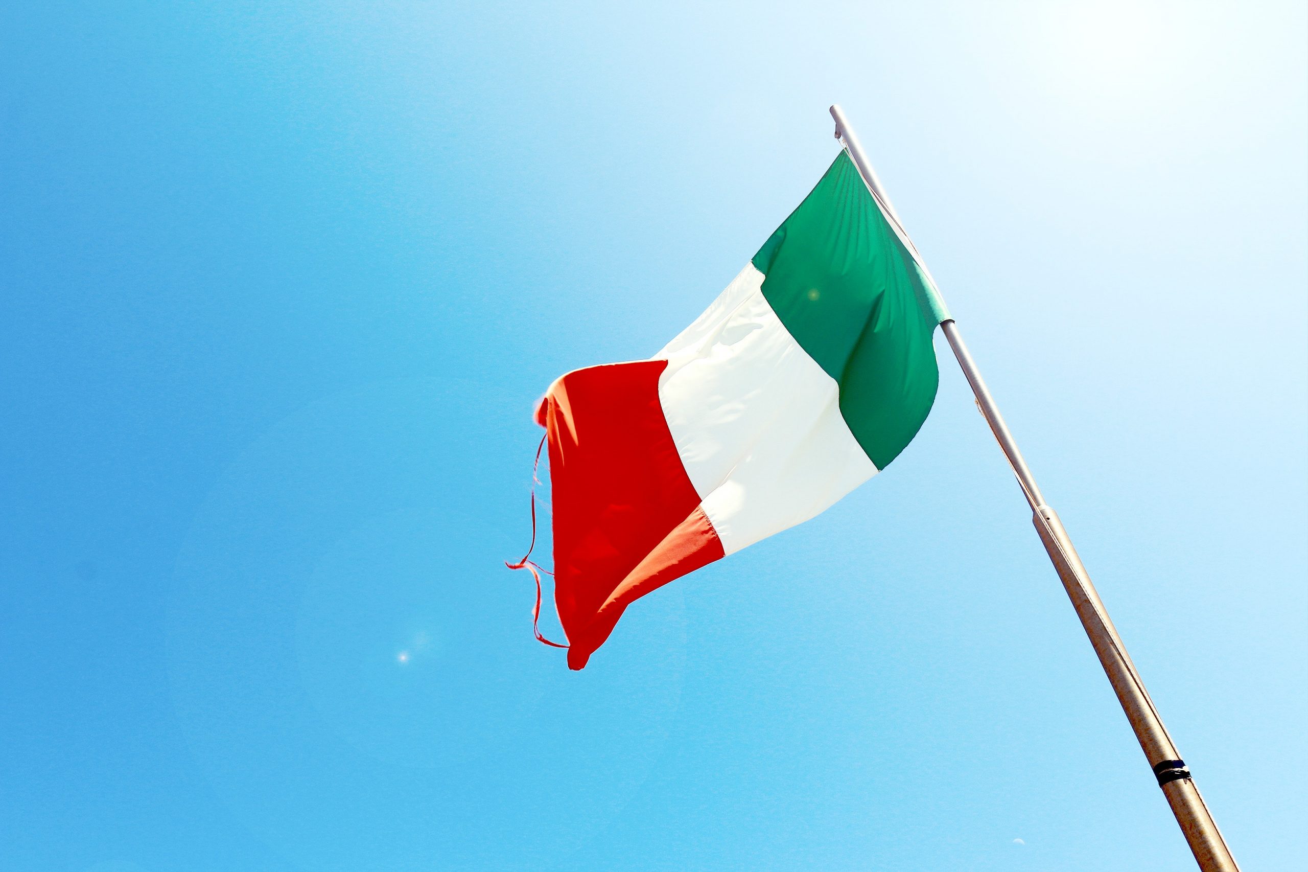 flag of italy against a blue sky