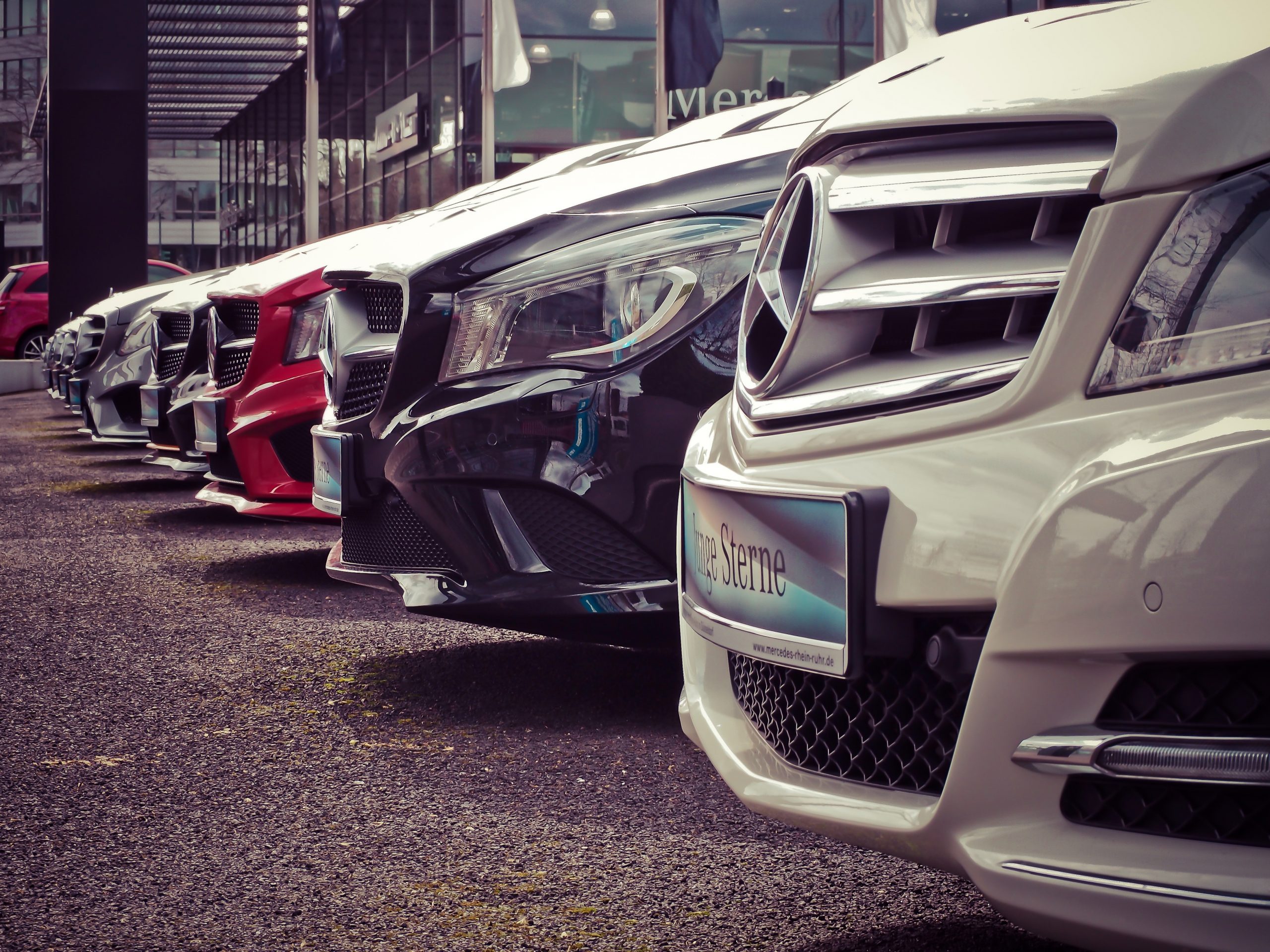 close up of a row of mercedes benz cars