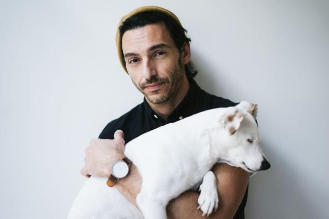 man holding dog