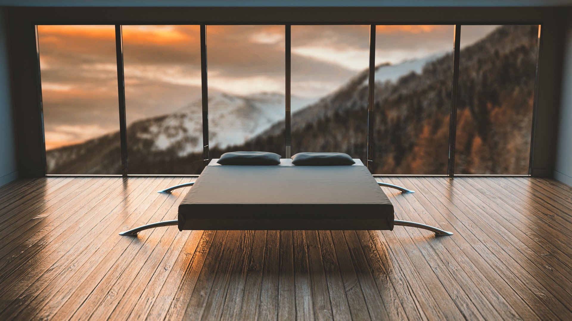 bed in a darkend room in view of full length windows