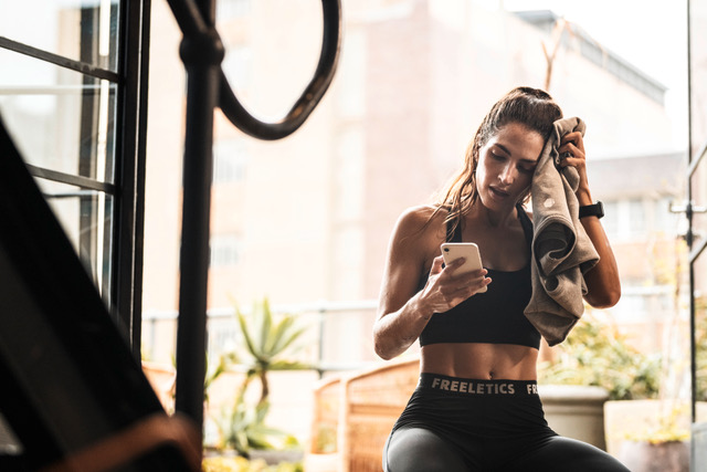 a woman in a window after a workout