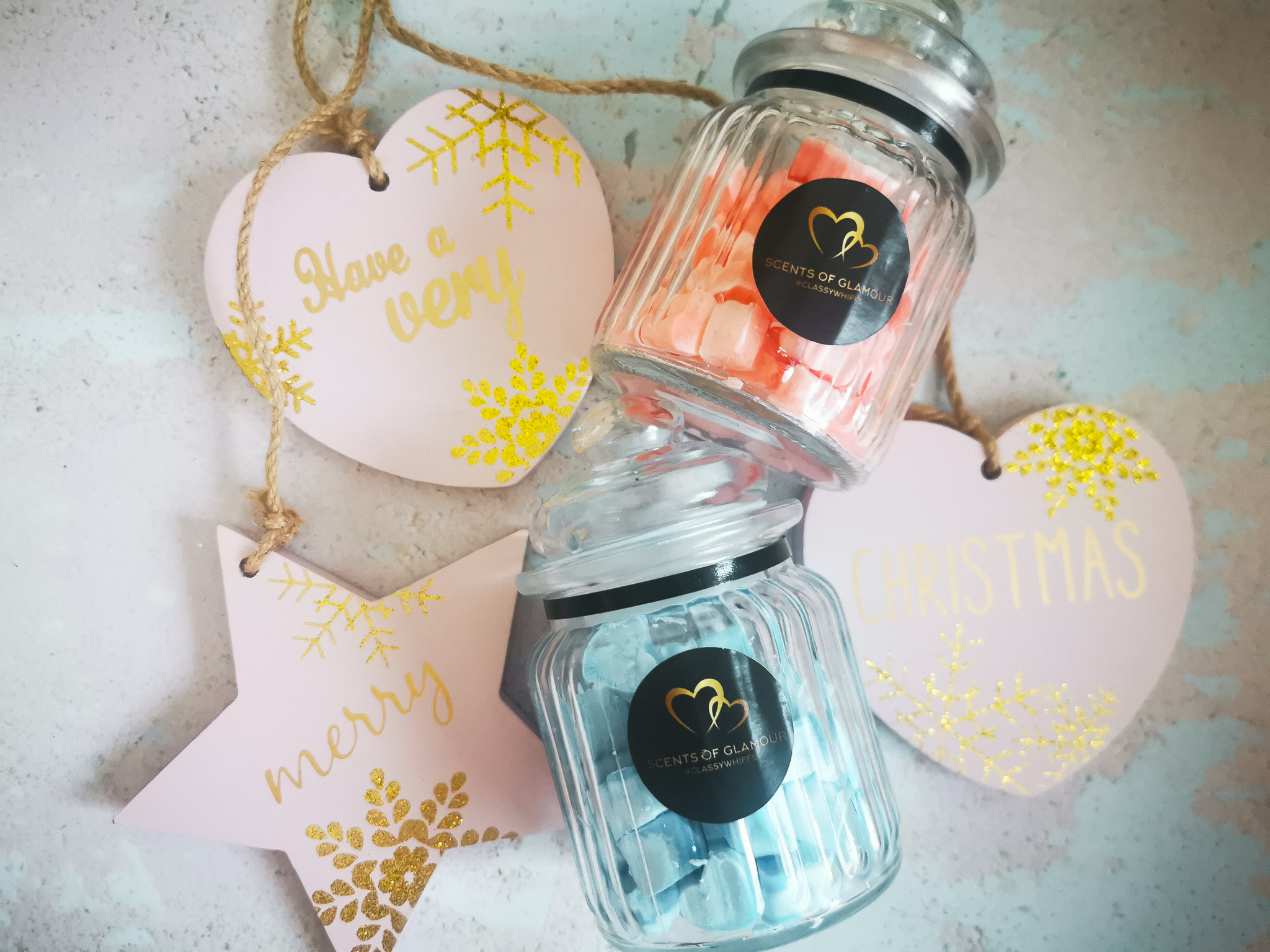 two jars of scents of glamour wax melts in a flatlay set up