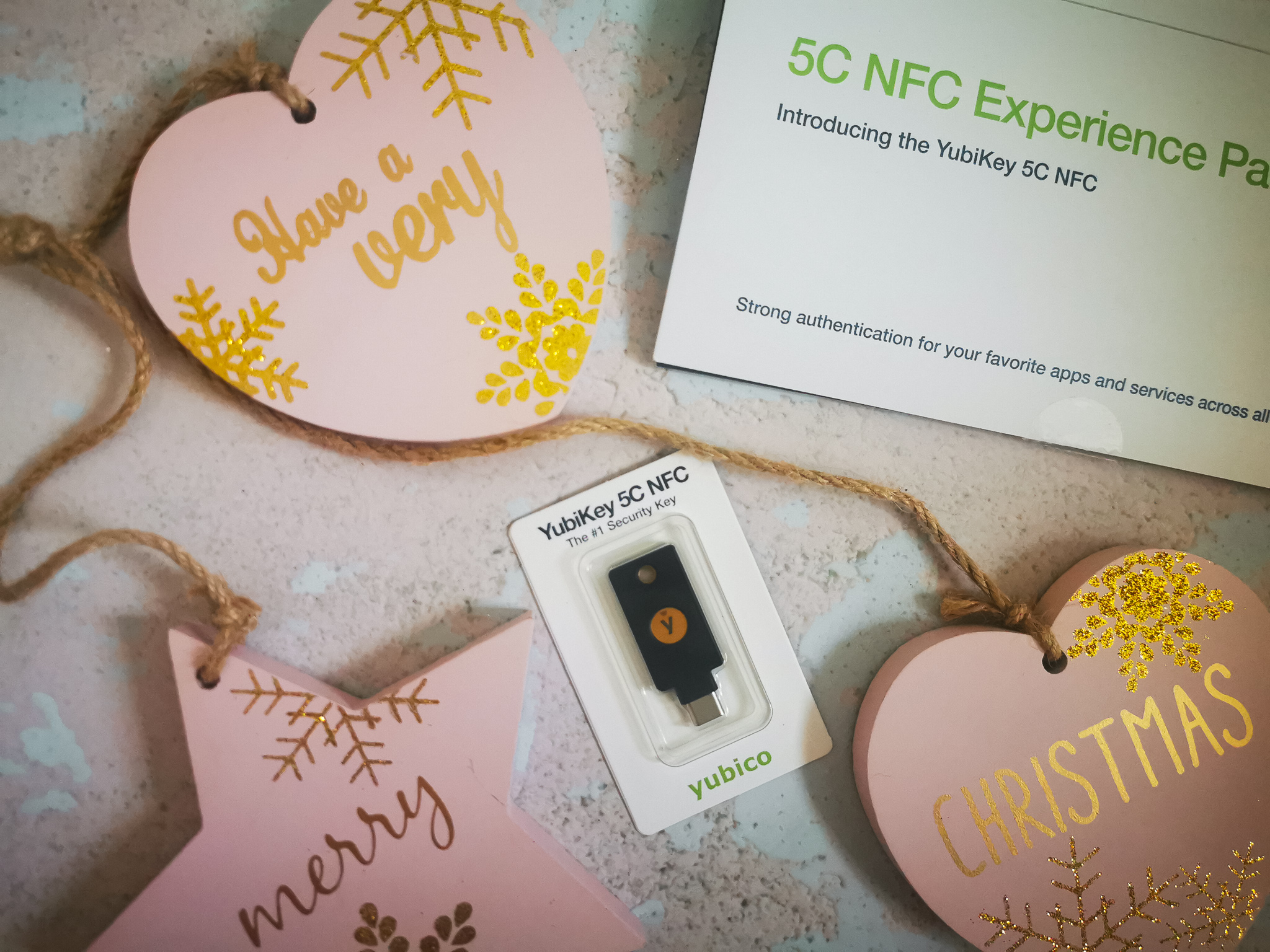 a yubikey in a christmas flatlay