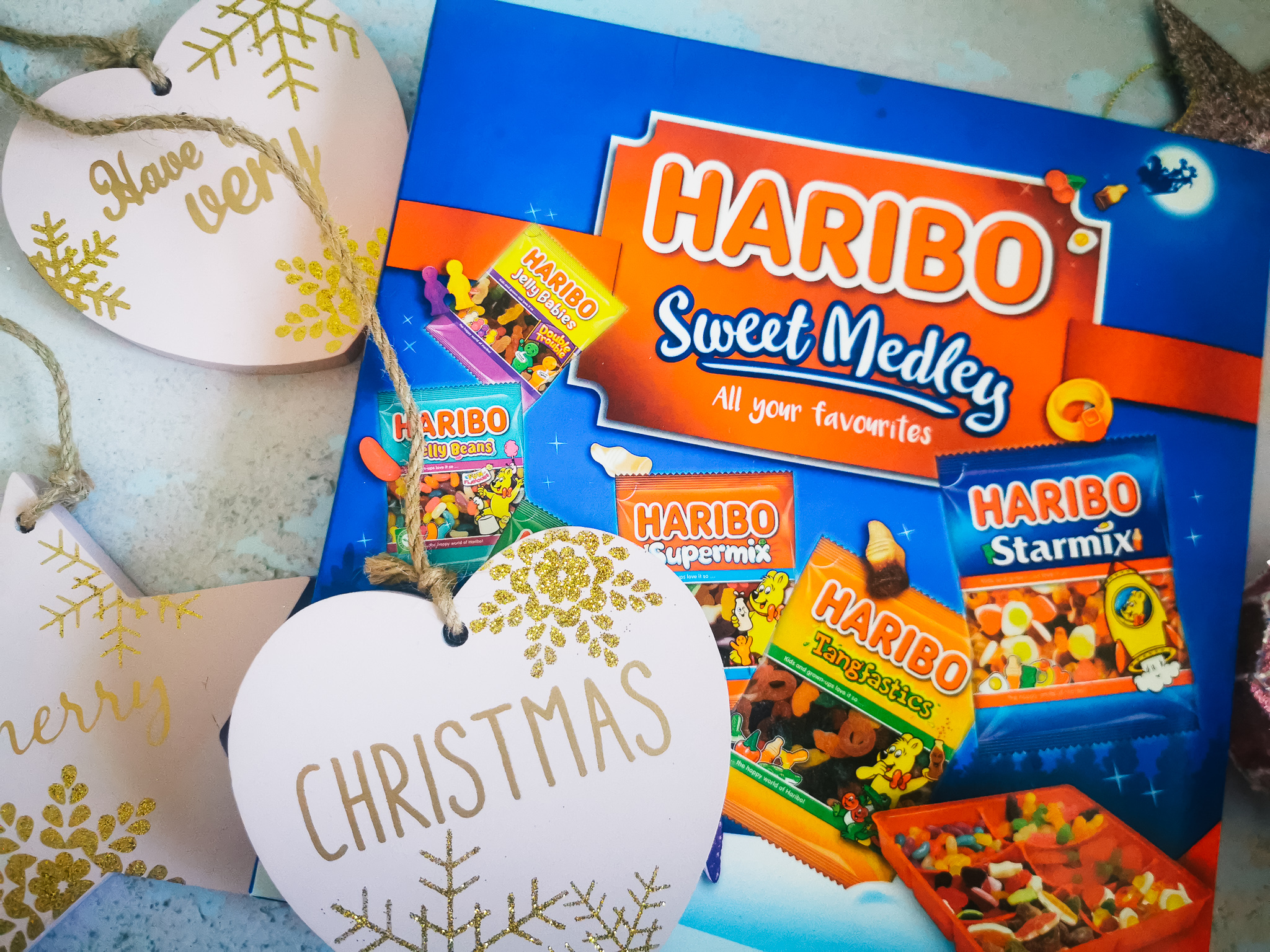 close up of a box of sahring Haribo with Christmas decorations
