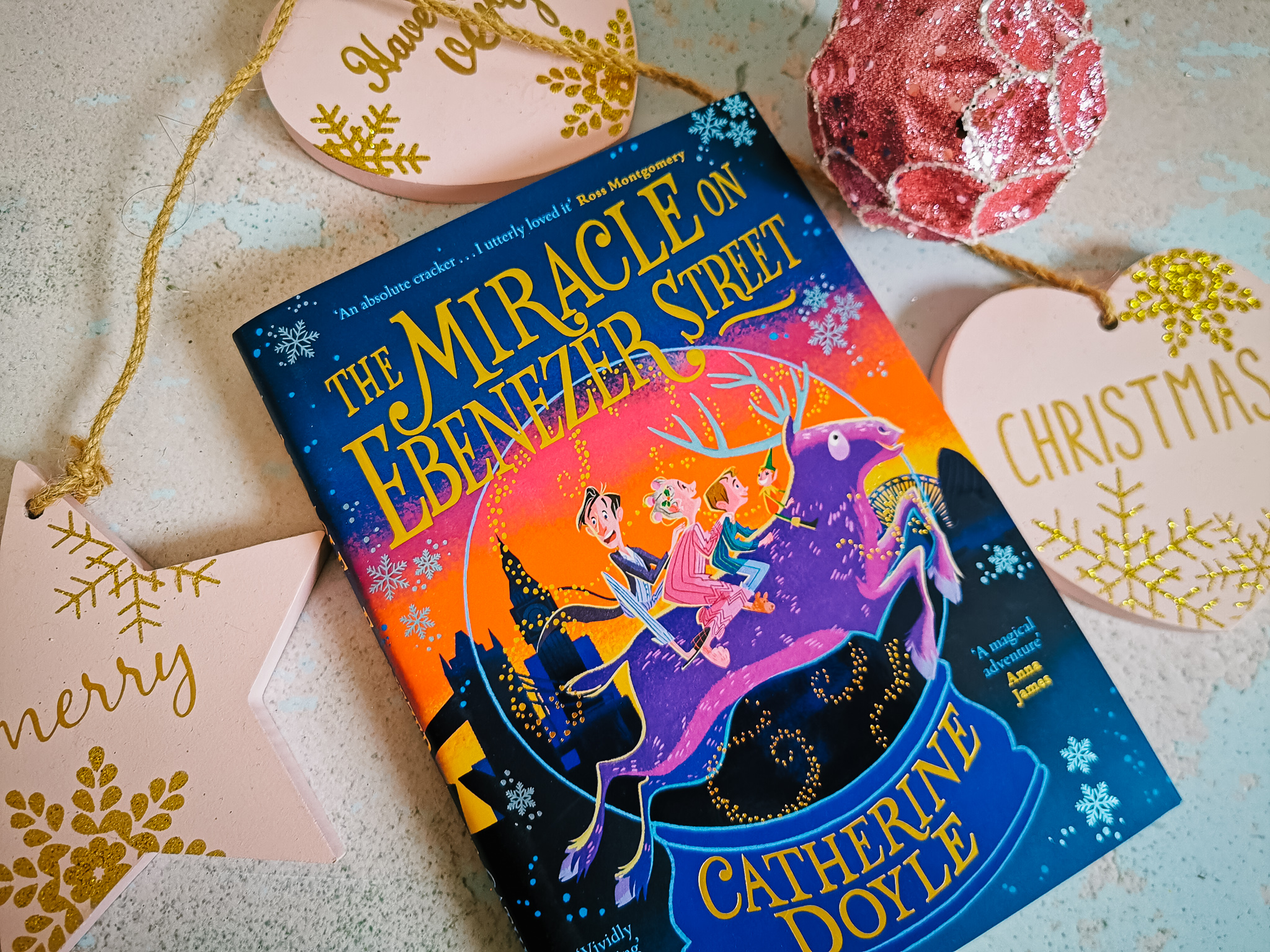 flatlay image of a book - the miracle on ebenezer street