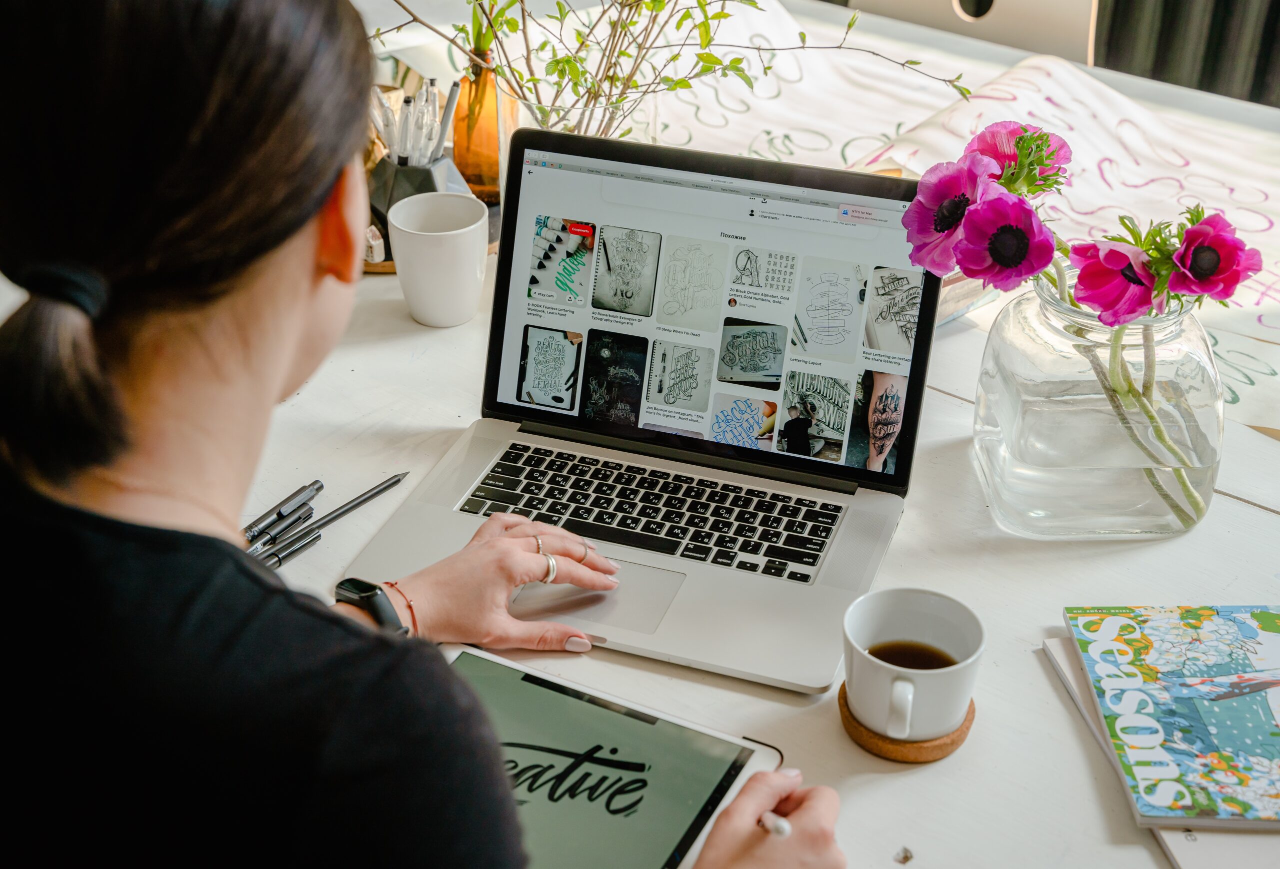 a person in front of a laptop at a desk