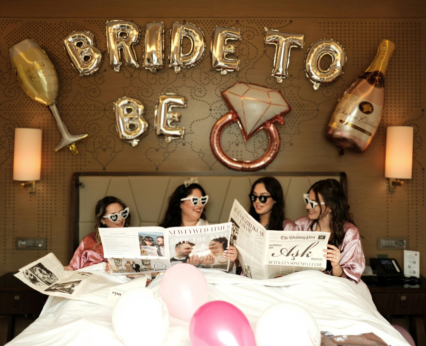 Bride celebrating with friends at a fun bachelorette party, all laughing and posing together.