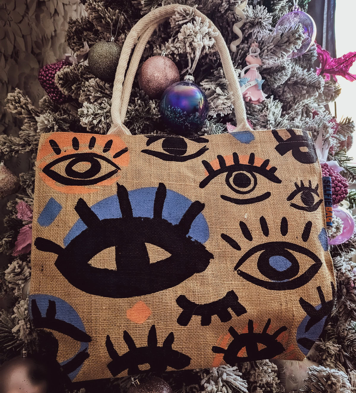 a selfie jute bag with eye shapes all over it form cotton bag co