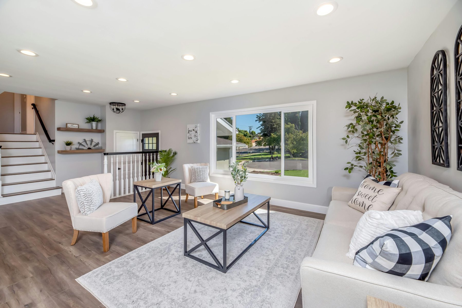 Bright modern living room with neutral decor and large windows