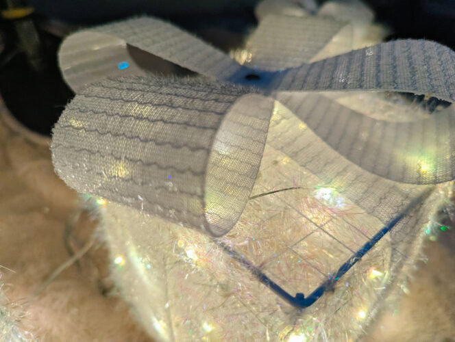 a close up of the box on the top of the quntis light-up present boxes in white