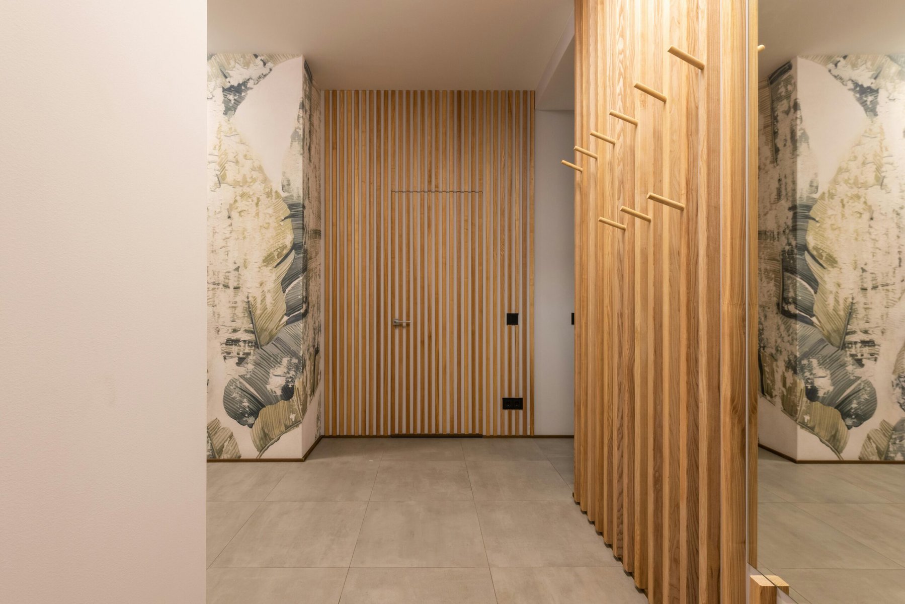 Interior living area with vertical wood panel dividers and contemporary design
